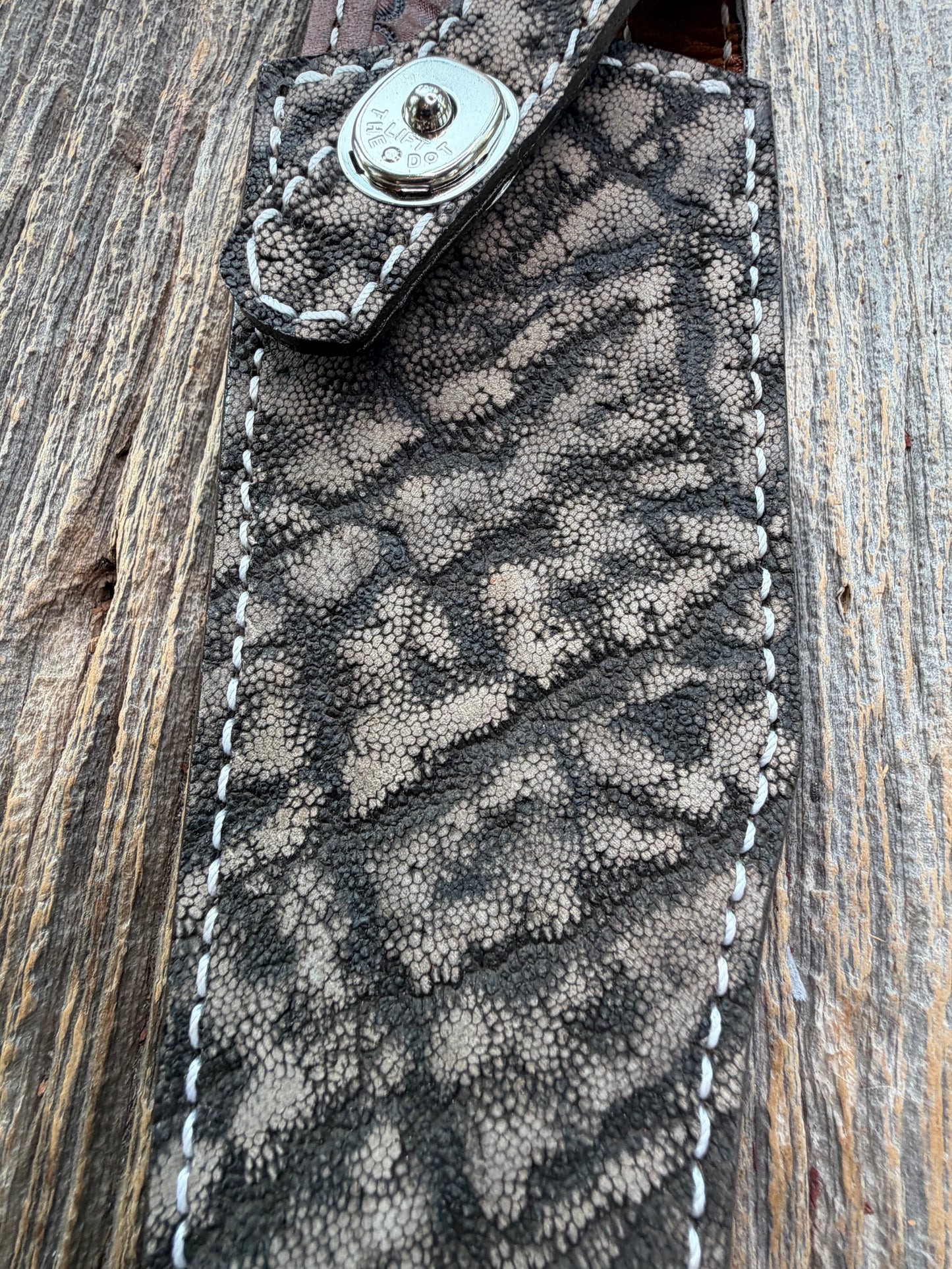 New Randall Model 27 Sheath in Exotic thick and textured Black and Grey Elephant Ear  on brown leather from Treeman with a black Canteen snap. Hand tooled belt loop. Killer sheath.