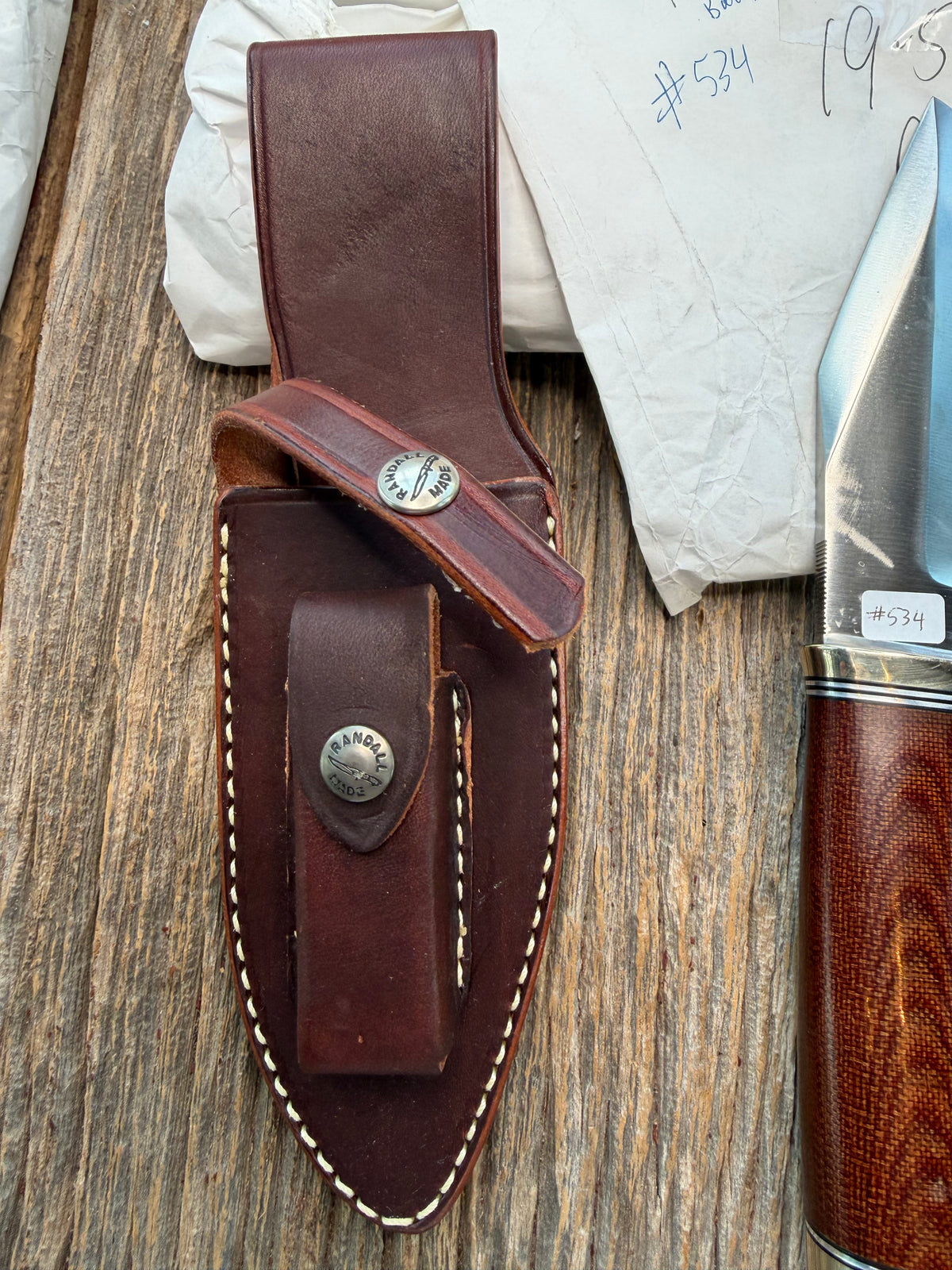 New in Paper Randall Model 19-5 with an attractive piece of Brown Micarta. Nickel silver single Hilt and buttcap , Stainless steel. Black and Aluminum spacers.