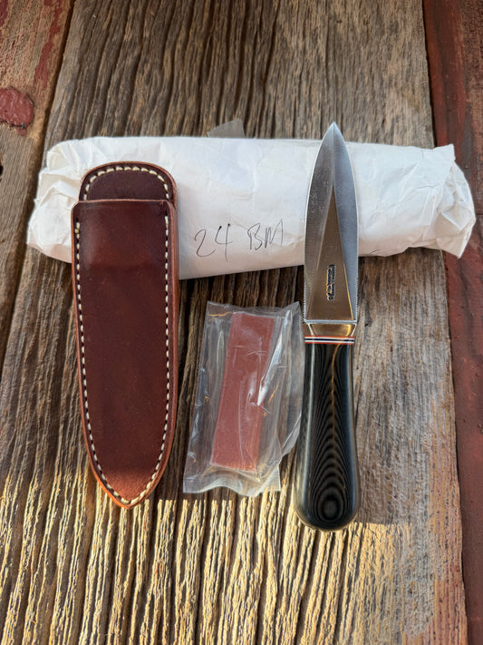 New in Paper Randall Model 24 Guardian in Black Micarta Nickel hilt, Stainless, red white blue spacers.