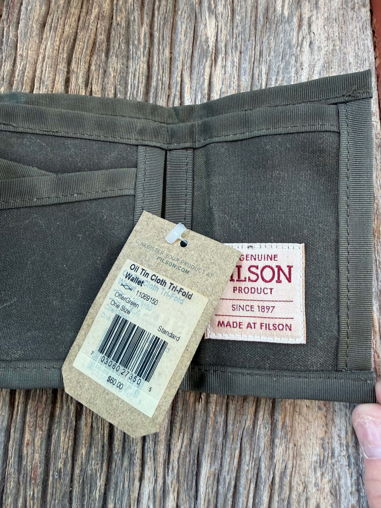 Adding to cart will not result in a sale. Personal Collection..Rare New with Tags Filson Oil Tin Cloth Tri Fold Wallet in Otter Green # 11069150 from February 2016.