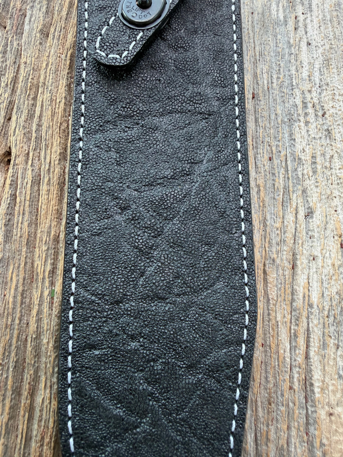 New Randall Model 12-9 Sheath in Exotic Black Matte Elephant Hide from Treeman with a Black Canteen snap. White thread deviated stitching on black leather..Killer sheath.