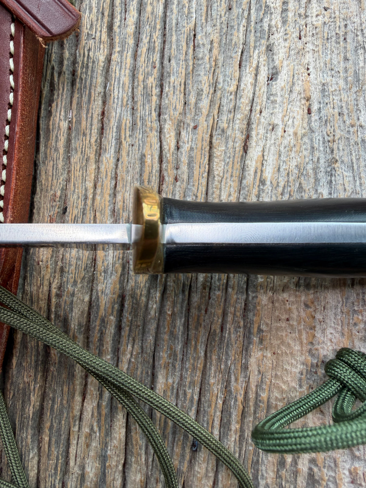 Nice Randall Model Combat Companion in Black Micarta. SS blade, brass hilt. Lanyard and paracord, Brown leather sheath.