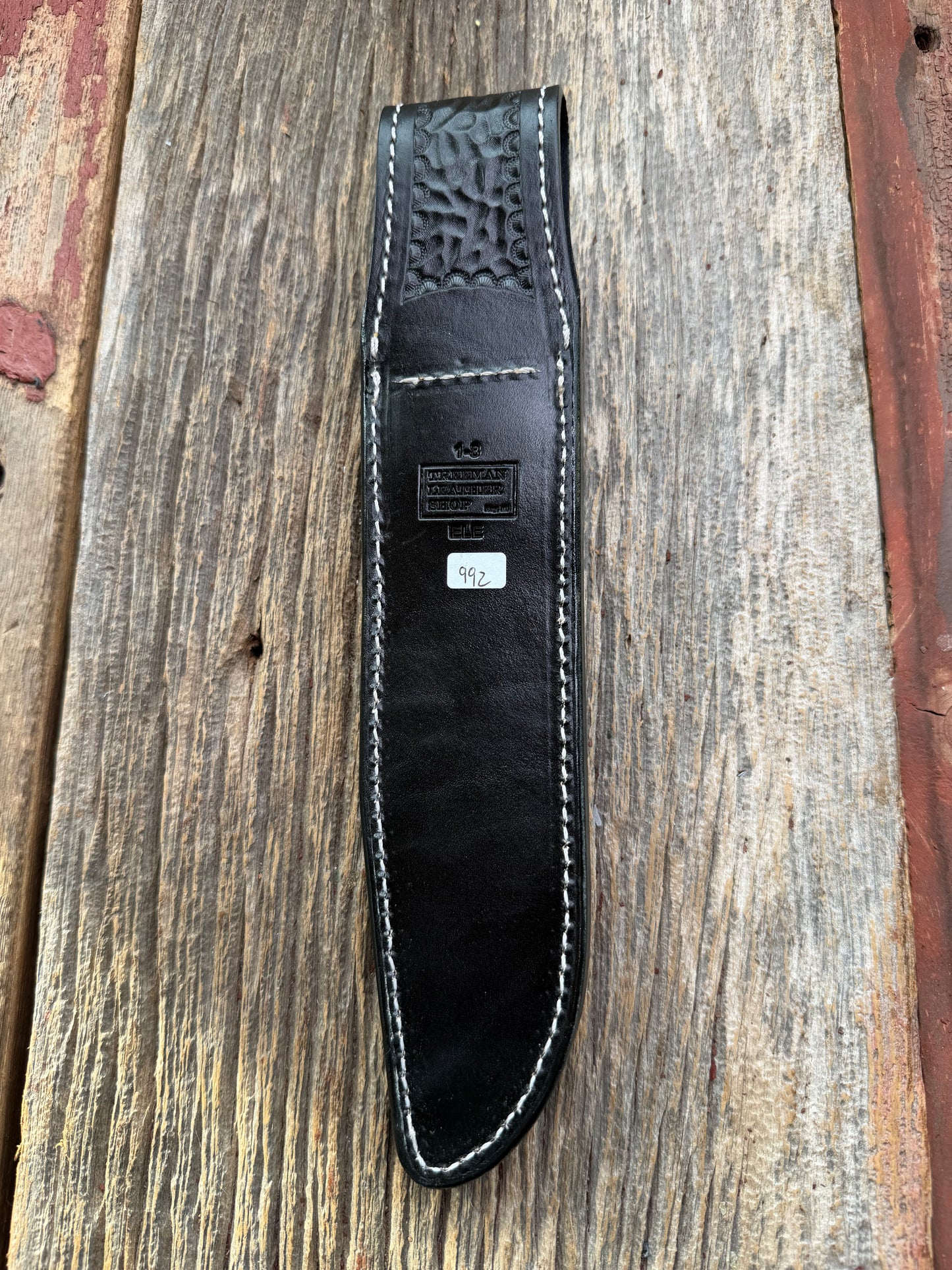 New Randall Model 1-8 Sheath in Exotic thick and textured Grey Elephant Hide on black leather from Treeman with a silver Canteen snap. Hand tooled belt loop. Killer sheath.