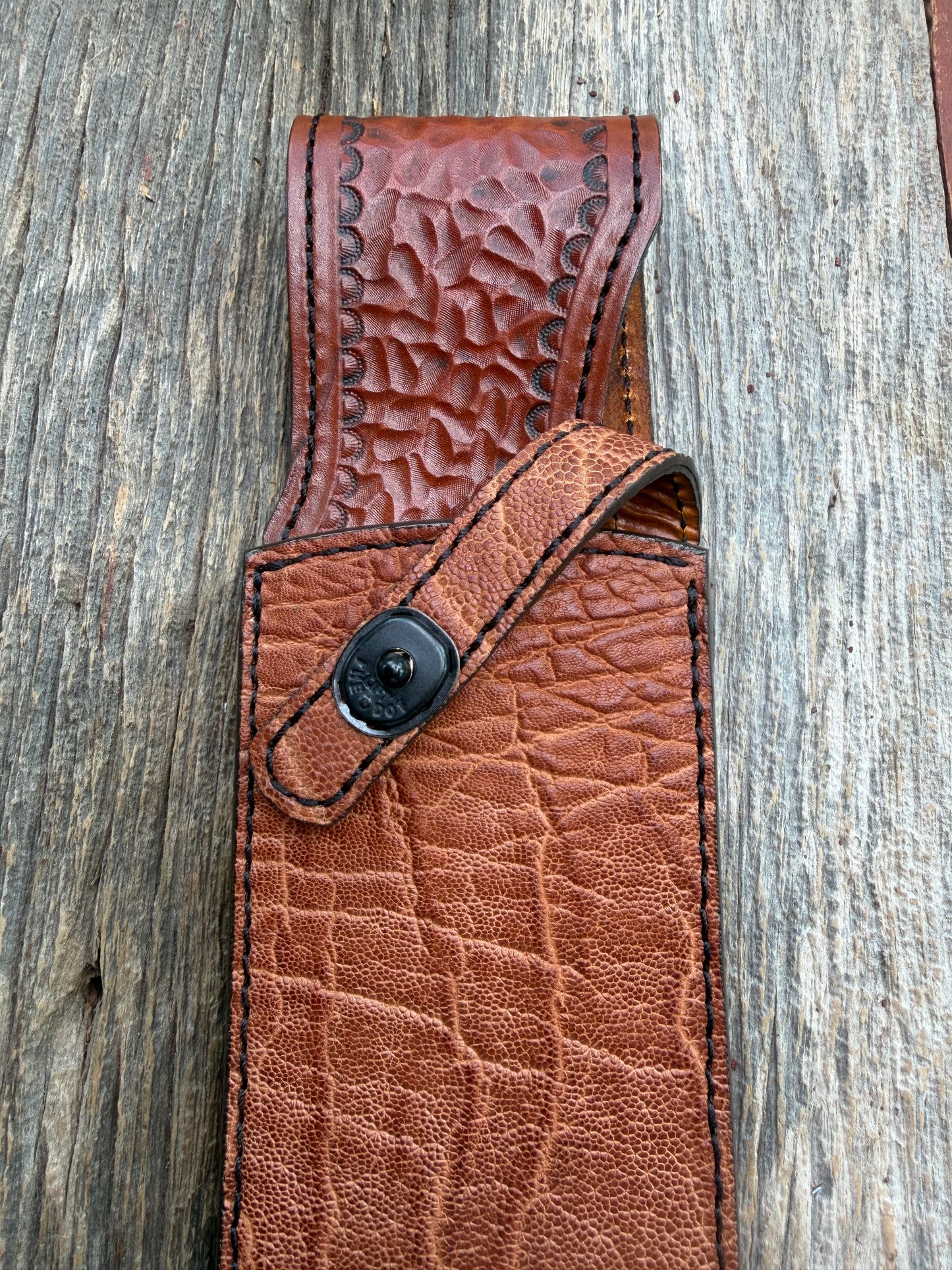 New Randall Model 12-11 Large Sasquatch Sheath in Exotic thick and textured Rust colored Elephant hide on brown leather from Treeman with a black Canteen snap. Hand tooled belt loop. Killer sheath.