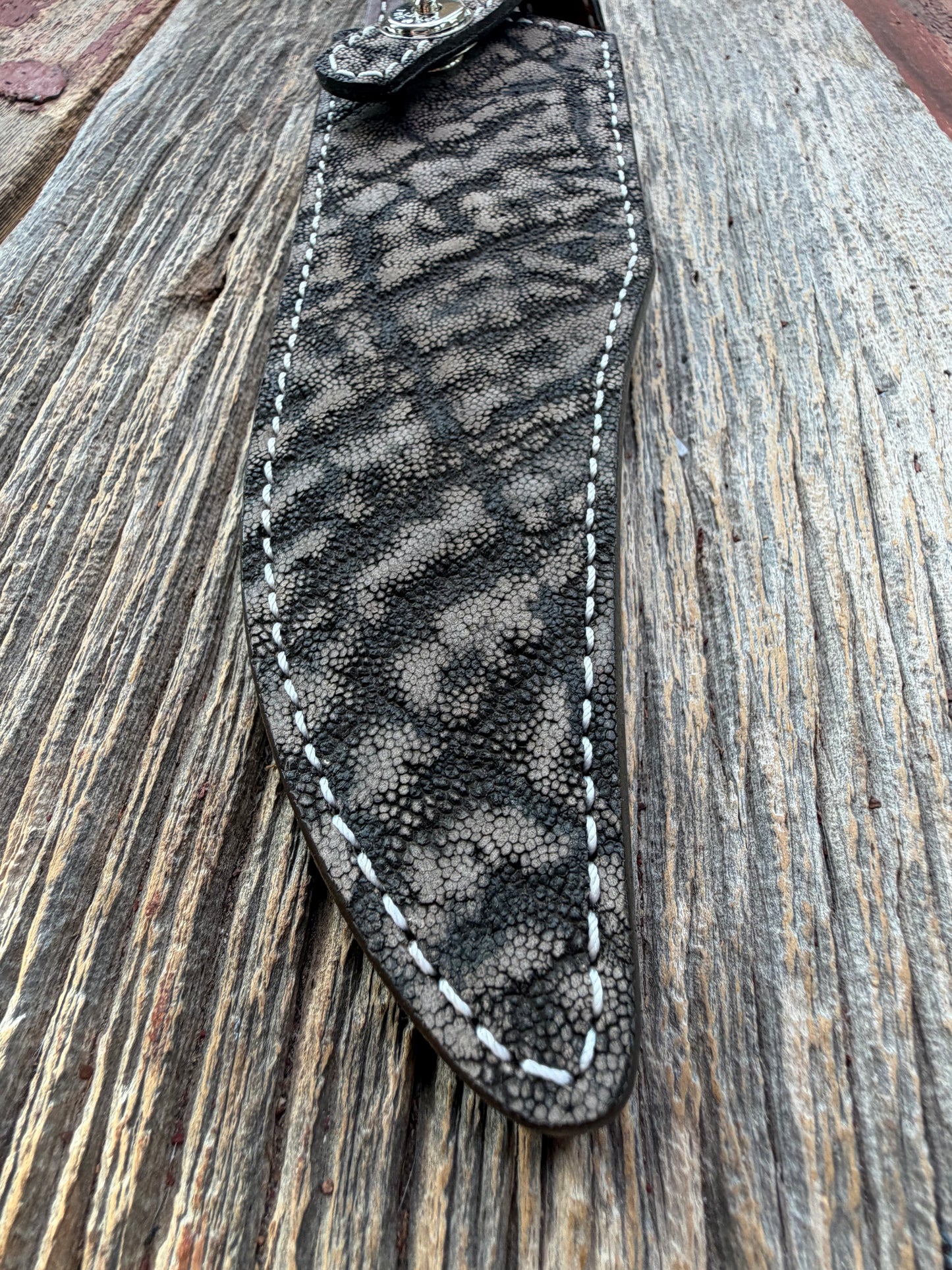 New Randall Model 27 Sheath in Exotic thick and textured Black and Grey Elephant Ear  on brown leather from Treeman with a black Canteen snap. Hand tooled belt loop. Killer sheath.
