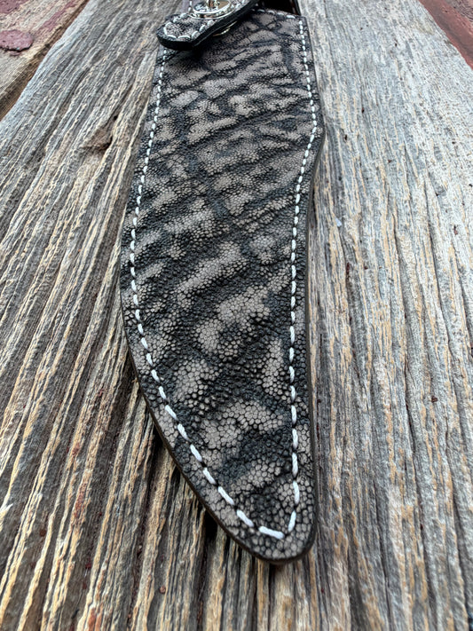 New Randall Model 27 Sheath in Exotic thick and textured Black and Grey Elephant Ear  on brown leather from Treeman with a black Canteen snap. Hand tooled belt loop. Killer sheath.