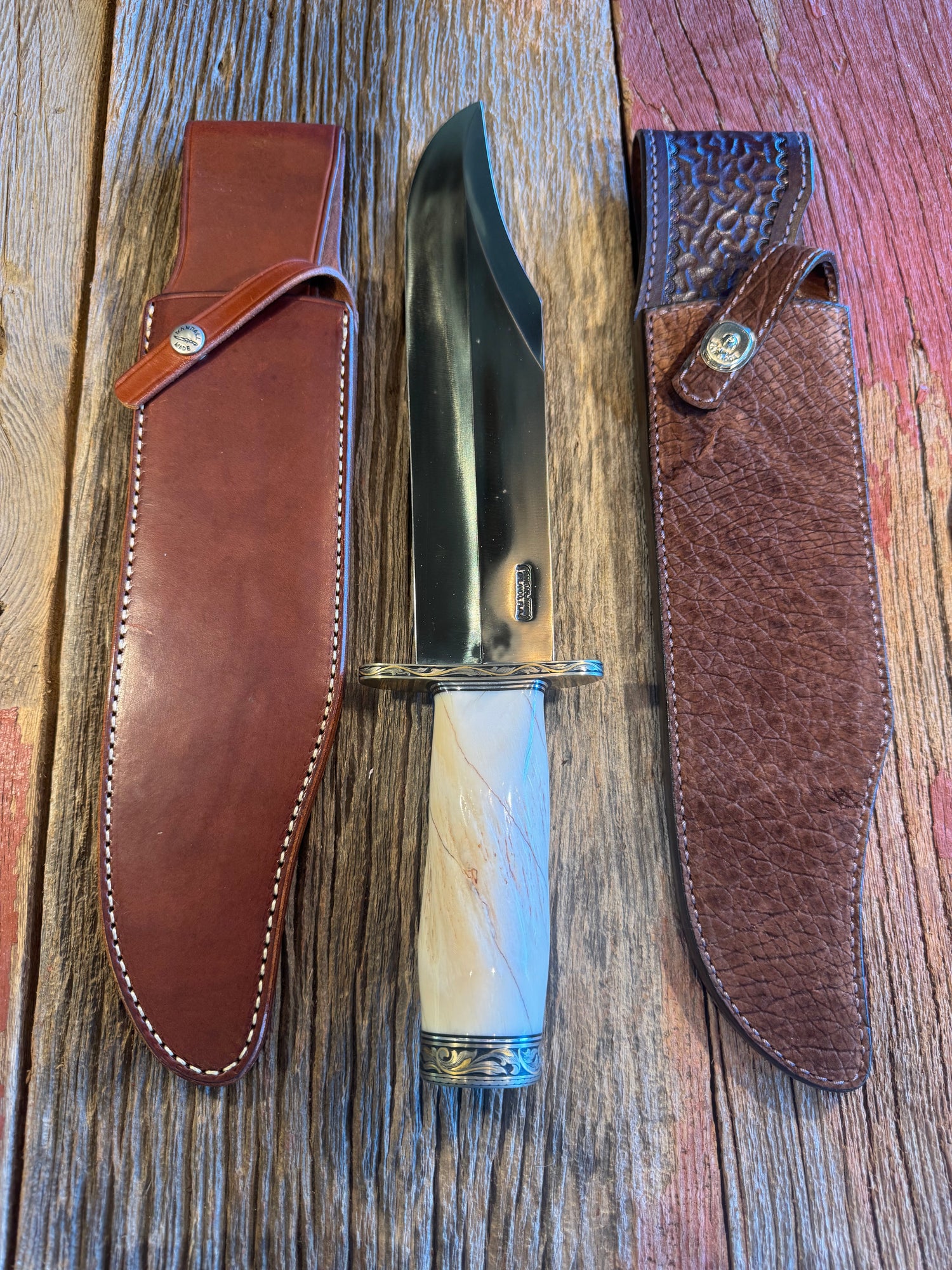 Rare Randall 12-11 Smithsonian with a huge piece of Beautiful Spiraled Narwal, Nickel Silver Hilt and butt cap both engraved and inlaid with copious amounts of gold and silver by Jere Davidson. Treeman Hippo Smitty Sheath included.