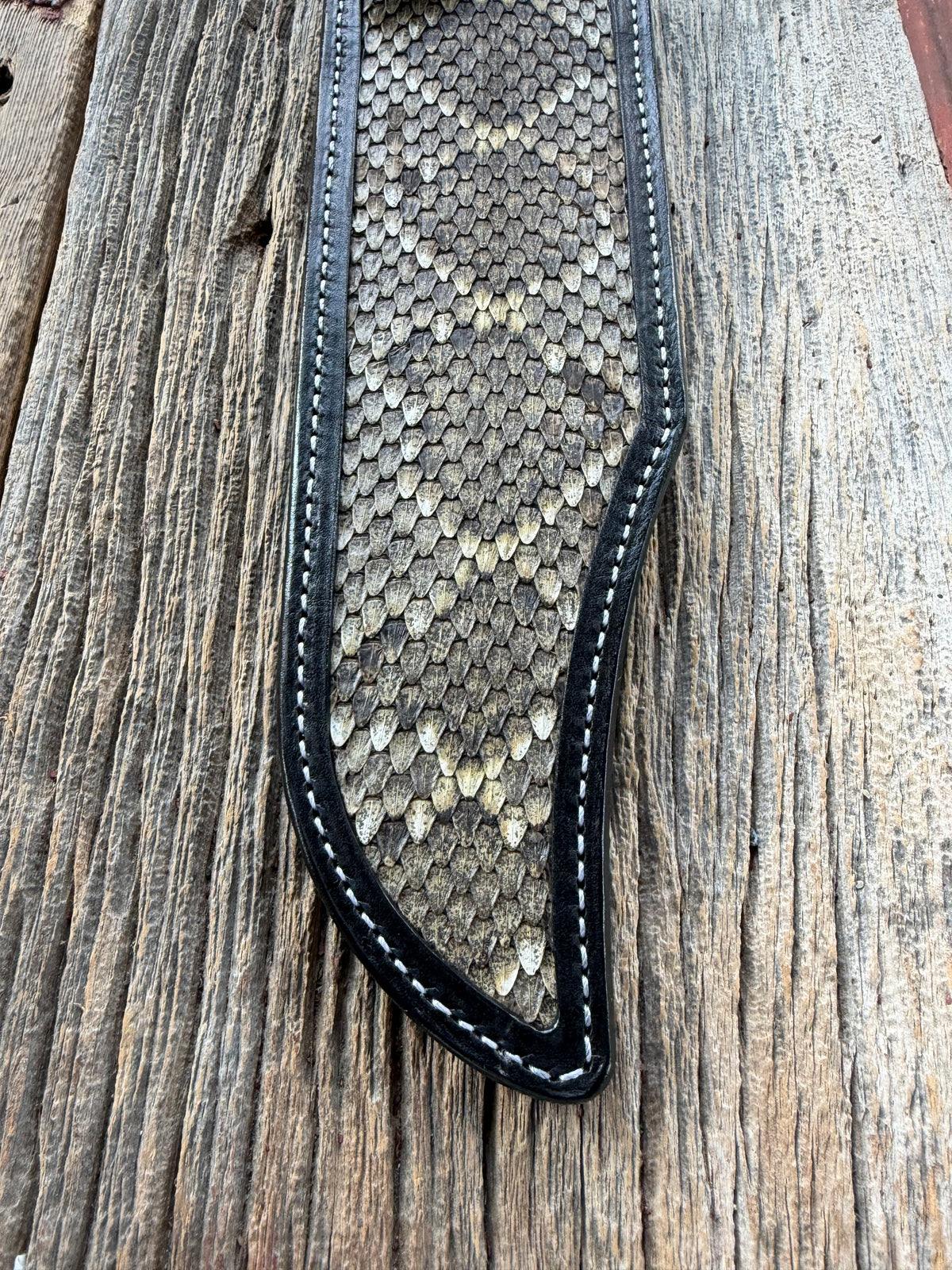 Randall Model Smithsonian sheath with a Western Diamondback RattleSnake skin inlay from Treeman Sheaths. Very dark skin, white thread deviated stitching, black canteen snap.