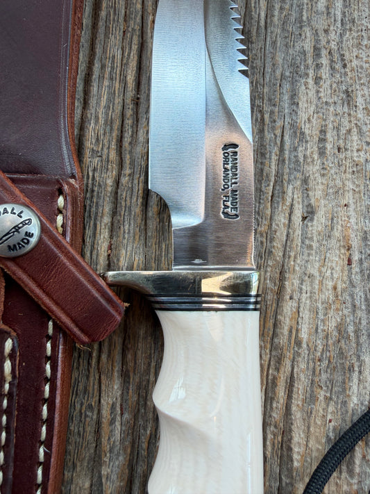 Randall Model Combat Companion with a nice piece of customer supplied Warthers Resin with finger grooves. Teeth, Nickel Silver Hilt and a raw natural end.
