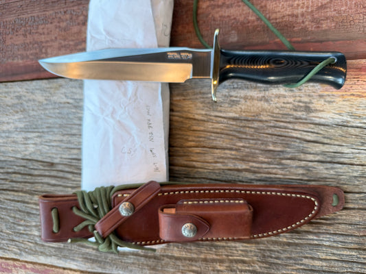 New in Paper Randall Model 16 SP#1 Special fighter with a Black Micarta handle. SS blade, Nickel silver Straight hilt. Lanyard. Brown leather sheath.
