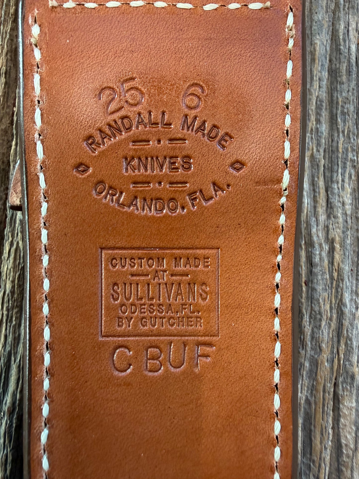 New Randall Model 25-6 Sheath in Exotic Brown Cape Buffalo with full leather hand tooled belt loop. Randall snap and stamp on the back. Custom Made at Sullivan’s by Gutcher