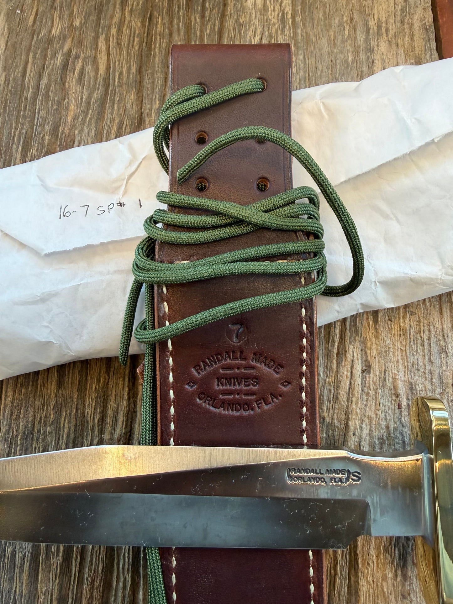 New in Paper Randall Model 16 SP#1 Special fighter with a Green Micarta handle. SS blade, Nickel silver hilt. Lanyard. Brown leather sheath.