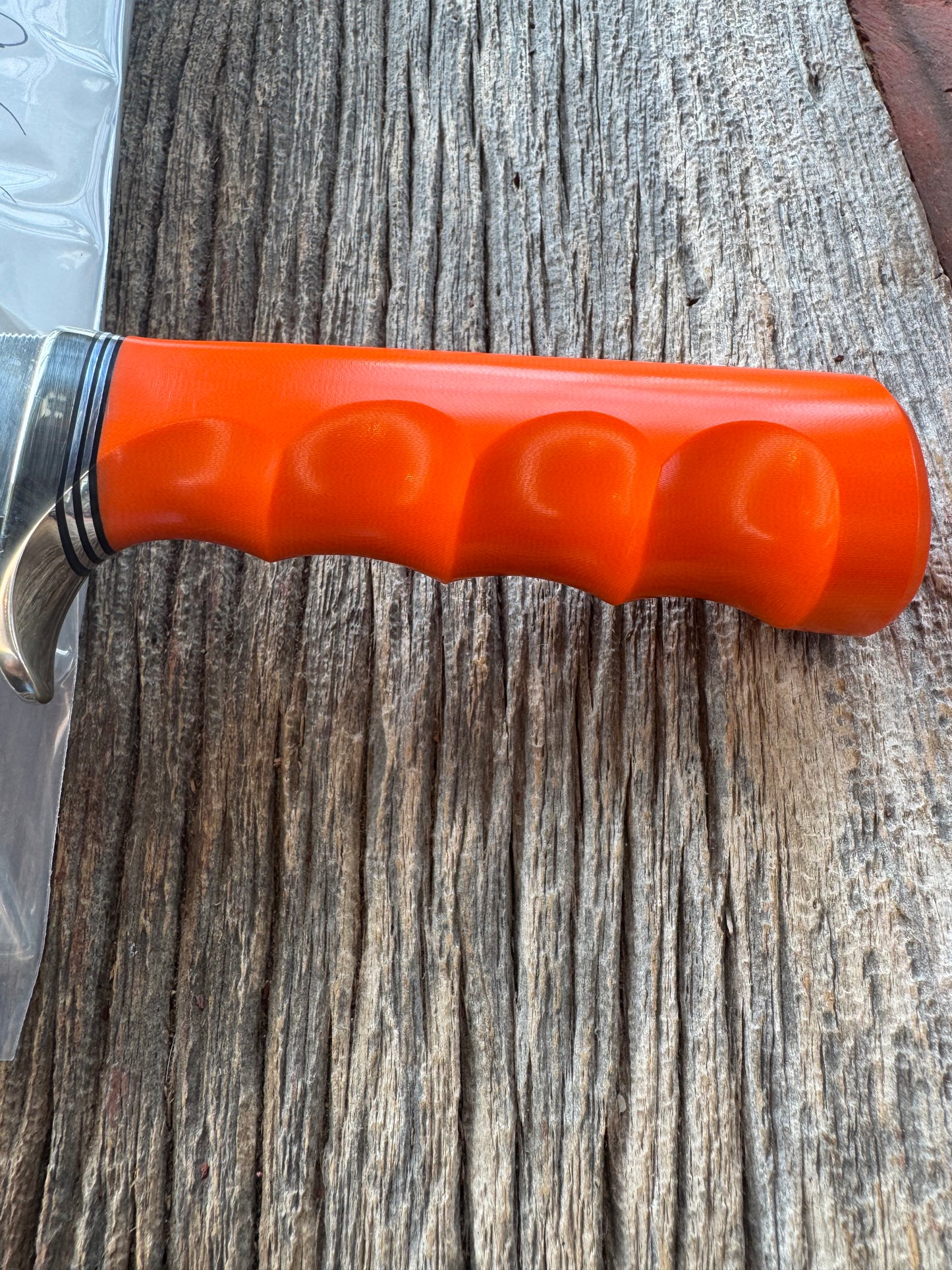New in paper Randall Model 19-5 with a nice piece of customer supplied Orange G10 with finger grooves. Stainless Steel, Nickel Silver Hilt and a raw natural end.