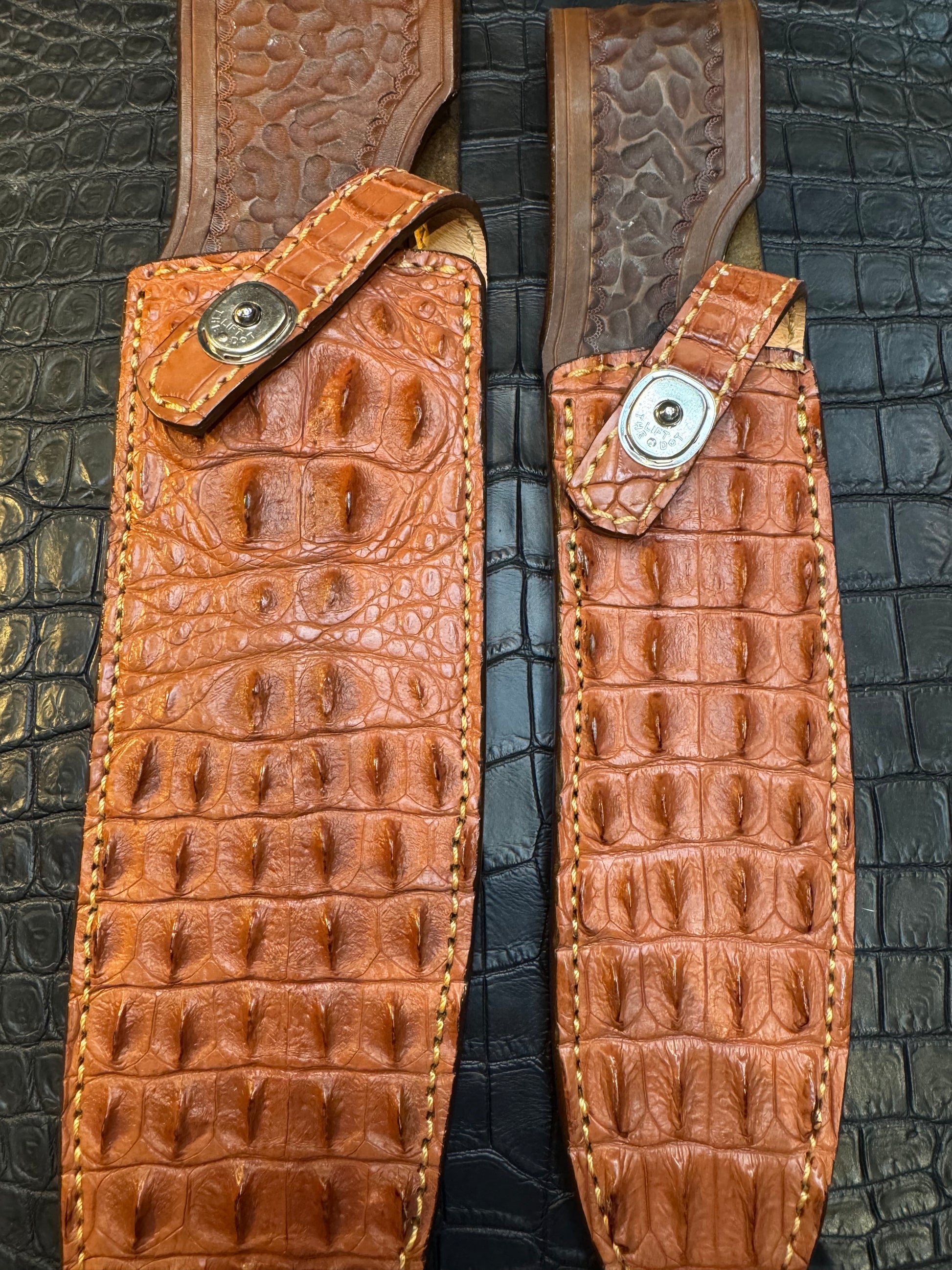 A pair of Randall Model 12-11 Large Sasquatch (Skull) and Randall Model 12-8 Small Sasquatch ( middle back) Sheaths in Exotic Tan Hornback Crocodile by Treeman.