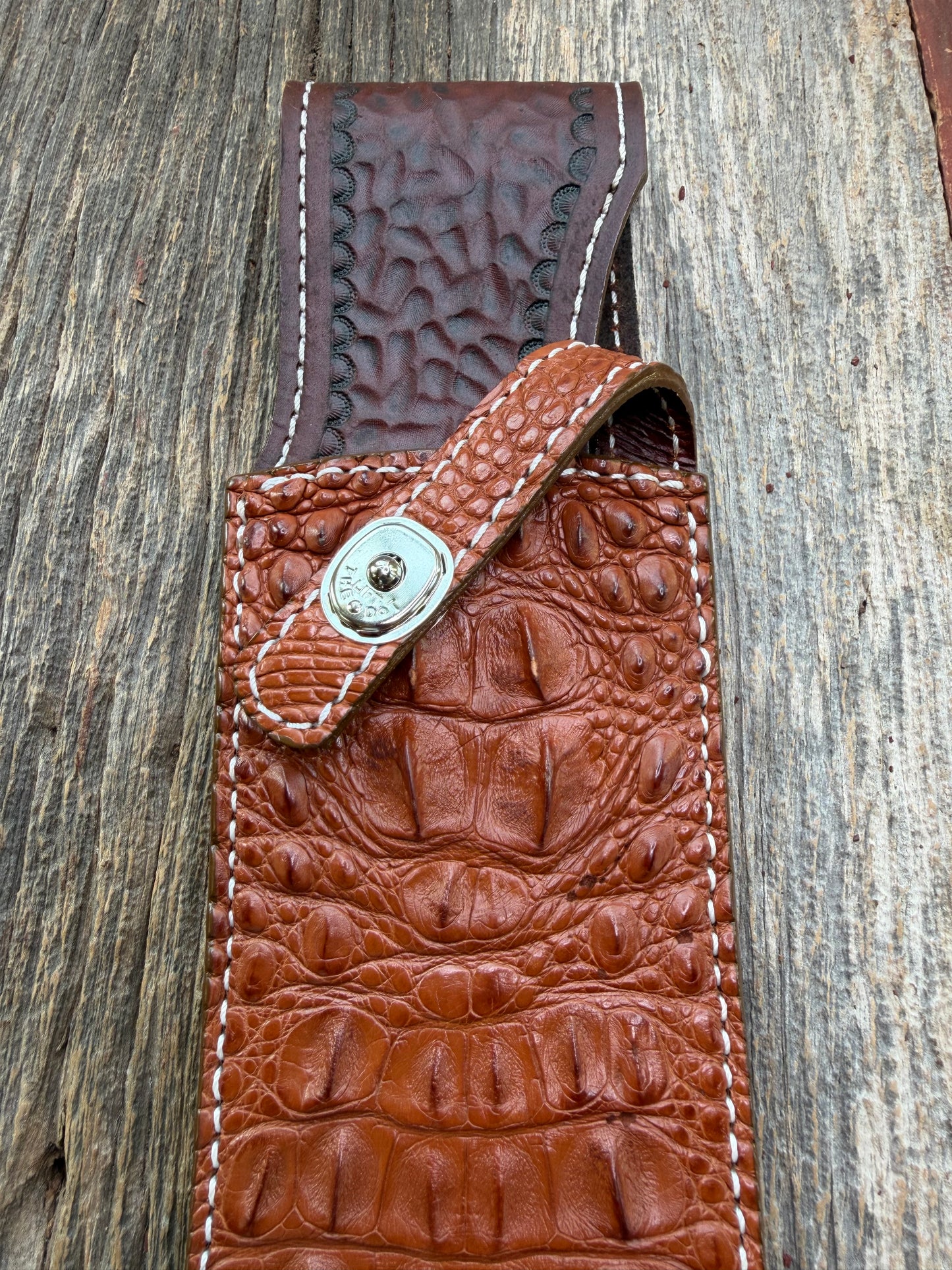 New Randall Model 12-11 Large Sasquatch Sheath in Exotic thick and textured Honey Crocodile skin ( skull portion) on brown leather from Treeman with a silver Canteen snap. Hand tooled belt loop. Killer sheath.