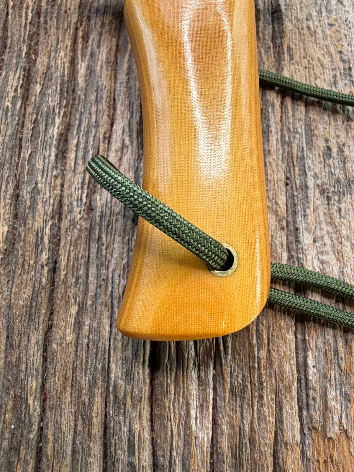 Randall Model 14-7.5 with a Yellow Micarta single finger handle. Carbon steel blade, brass double hilt, brown leather sheath, Lanyard.