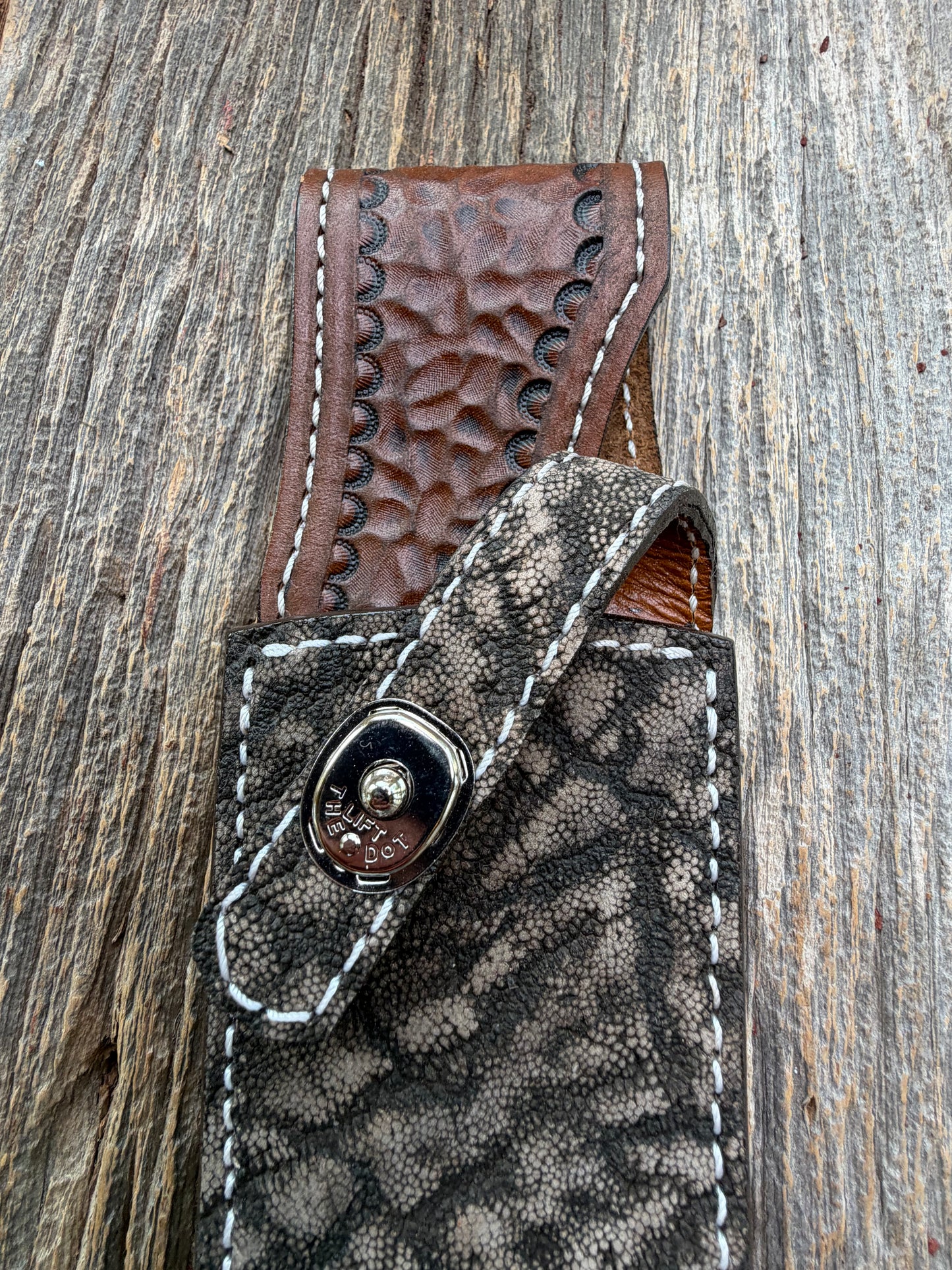 New Randall Model 27 Sheath in Exotic thick and textured Black and Grey Elephant Ear  on brown leather from Treeman with a black Canteen snap. Hand tooled belt loop. Killer sheath.