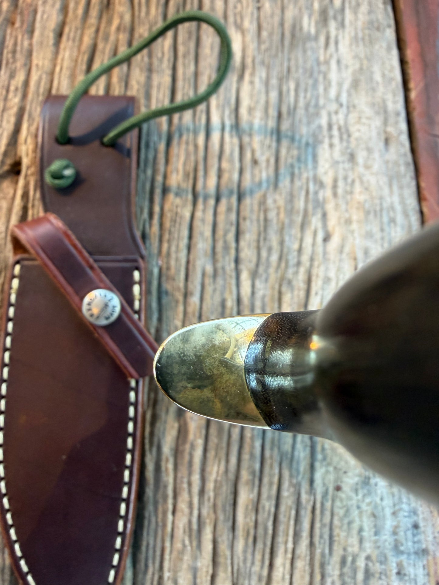 Nice Randall Model 28 Woodsman in Black Micarta. SS blade, brass single hilt. Lanyard. Brown leather sheath.
