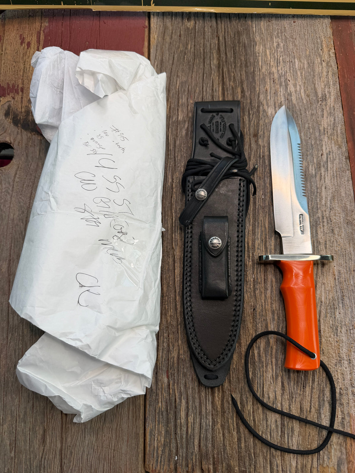 New in Paper Randall Model 14-7.5 with an Orange G10 Micarta Handle. Single Finger grip, SS, Black Sheath, Lanyard and Sawteeth.