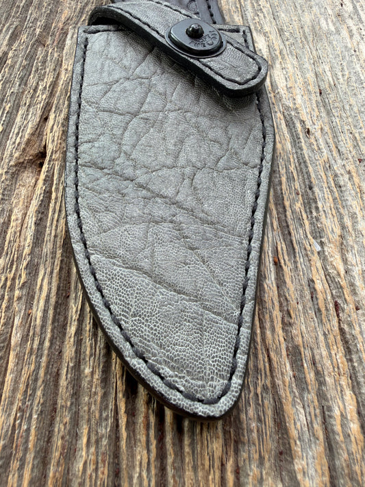New Randall Model 19-5 Sheath in Exotic thick and textured Grey Elephant Hide on black leather from Treeman with a black Canteen snap. Hand tooled belt loop. Killer sheath.