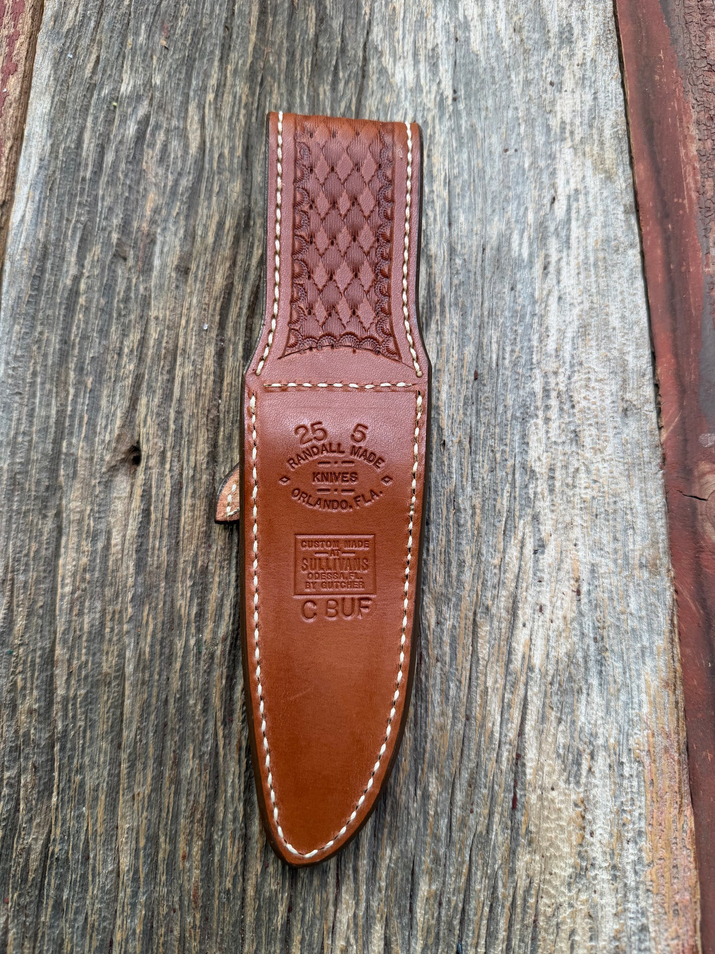 Pristine Randall Model 25-5 sheath in Exotic Cape Buffalo leather from Sullivans by Gutcher. Heavily tooled belt loop and strap. Randall snap and clean stamping on the back … perfect!!