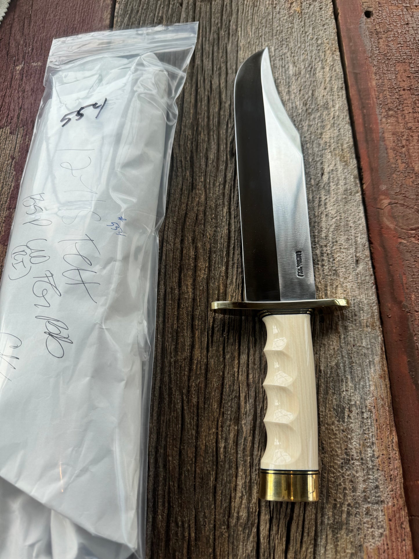 New in Paper Model 12-11 Smithsonian “Smitty” Bowie. Beautiful Dave Warthers Resin with a finger grooves grip and a Brass forward curved hilt and brass butt cap.