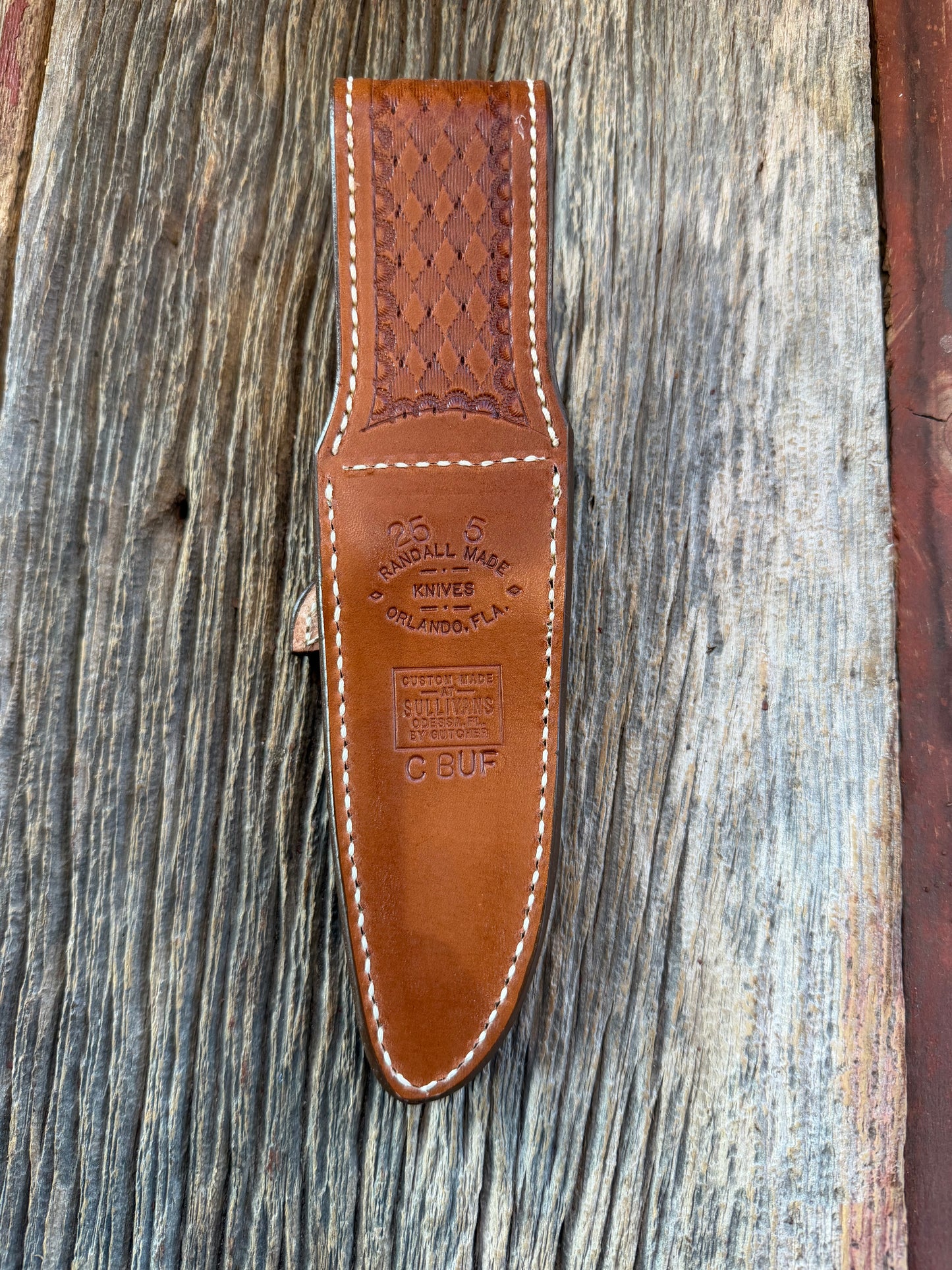 New Randall Model 25-5 Sheath in Exotic Brown Cape Buffalo with full leather hand tooled belt loop. Randall snap and stamp on the back. Custom Made at Sullivan’s by Gutcher