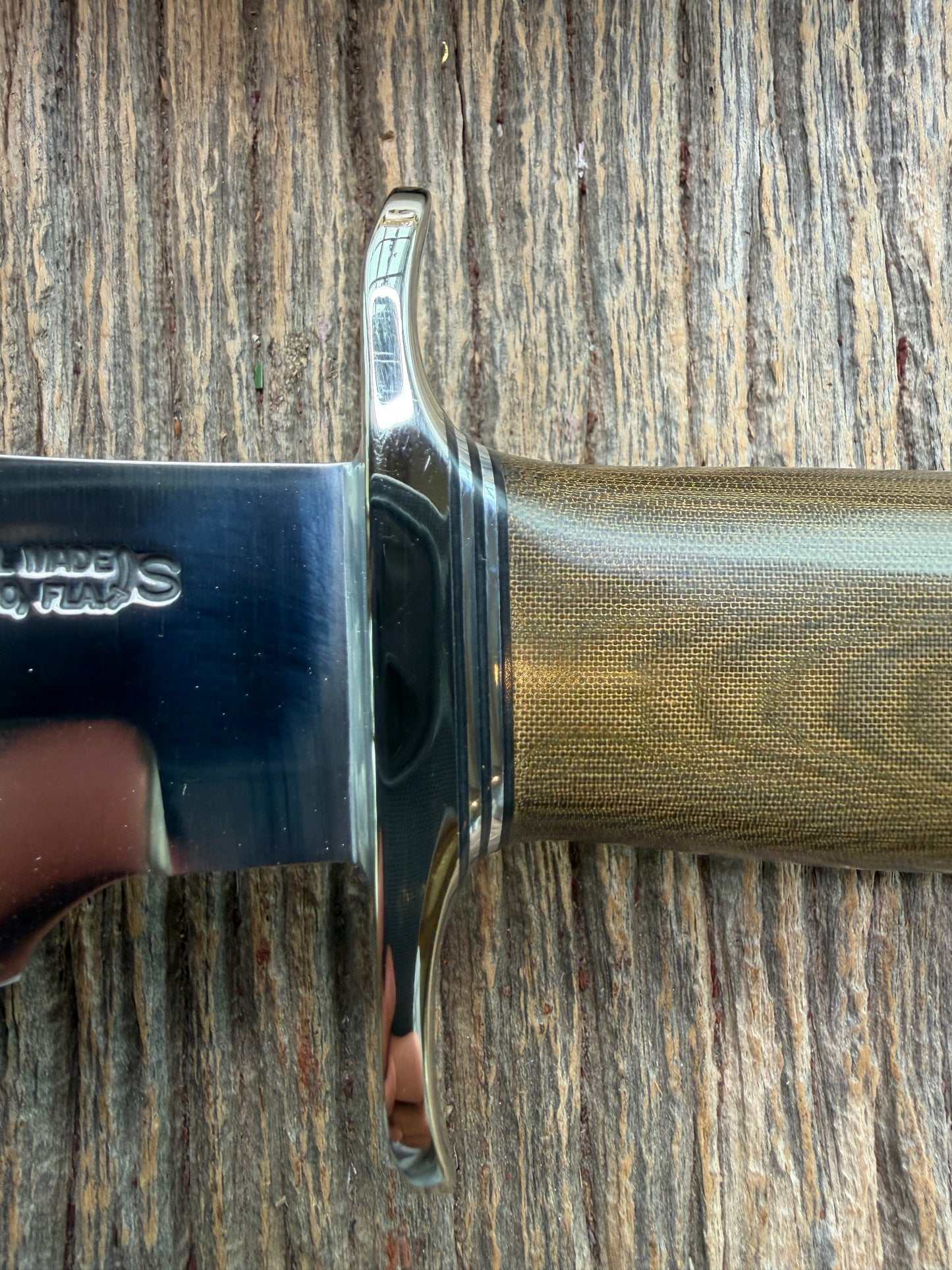 New in Paper Randall Model 19-5 Bushmaster with a Green Micarta handle. Stainless steel blade, Nickel silver hilt. Brown leather sheath. Crows Beak Aluminum handle.