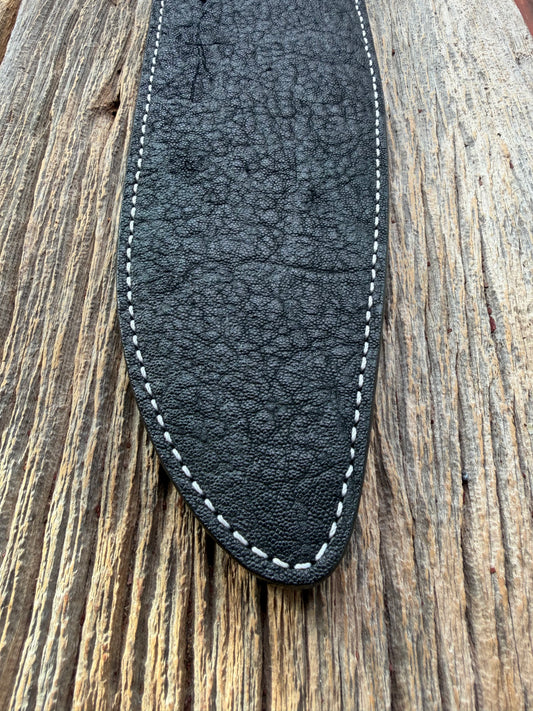 New Randall Model 12-11 Large Sasquatch Sheath in Exotic thick and textured Black Elephant hide on black leather from Treeman with a black Canteen snap. Hand tooled belt loop. Killer sheath.