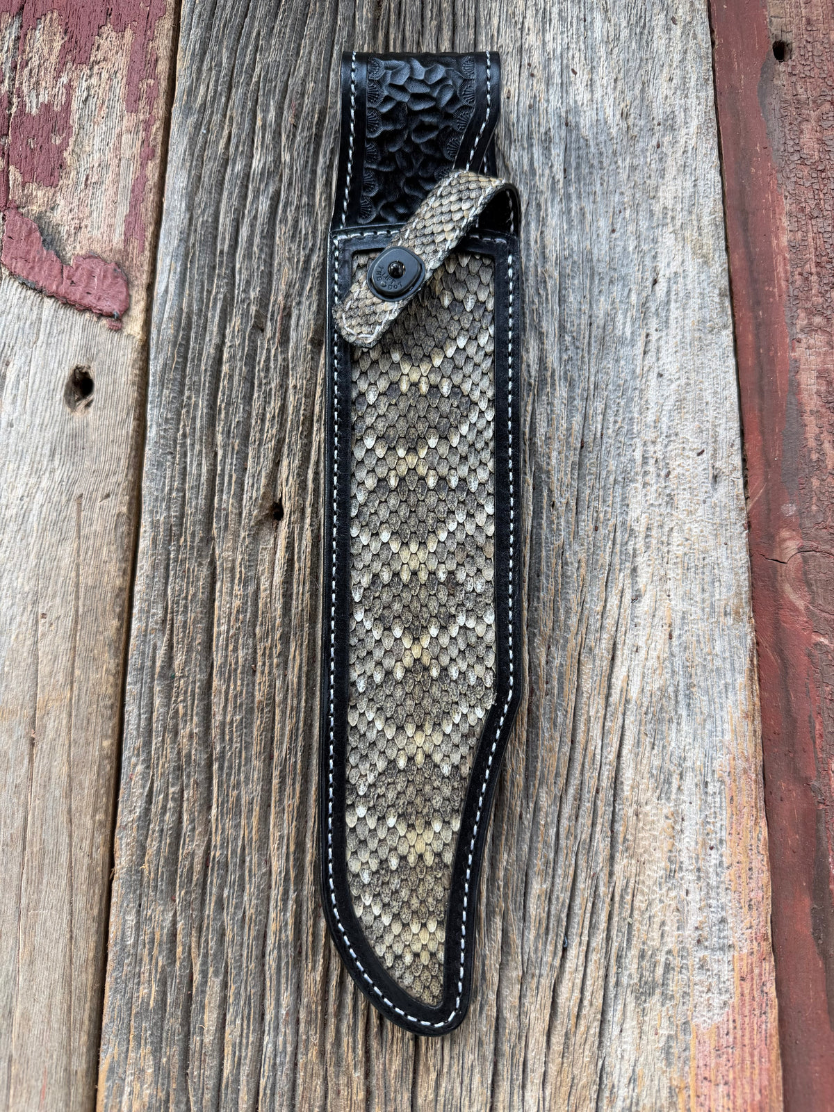 Randall Model Confederate sheath with inlayed Western Diamondback RattleSnake skin from Treeman Sheaths. Very dark skin on brown leather, white deviated stitching and black canteen snaps.