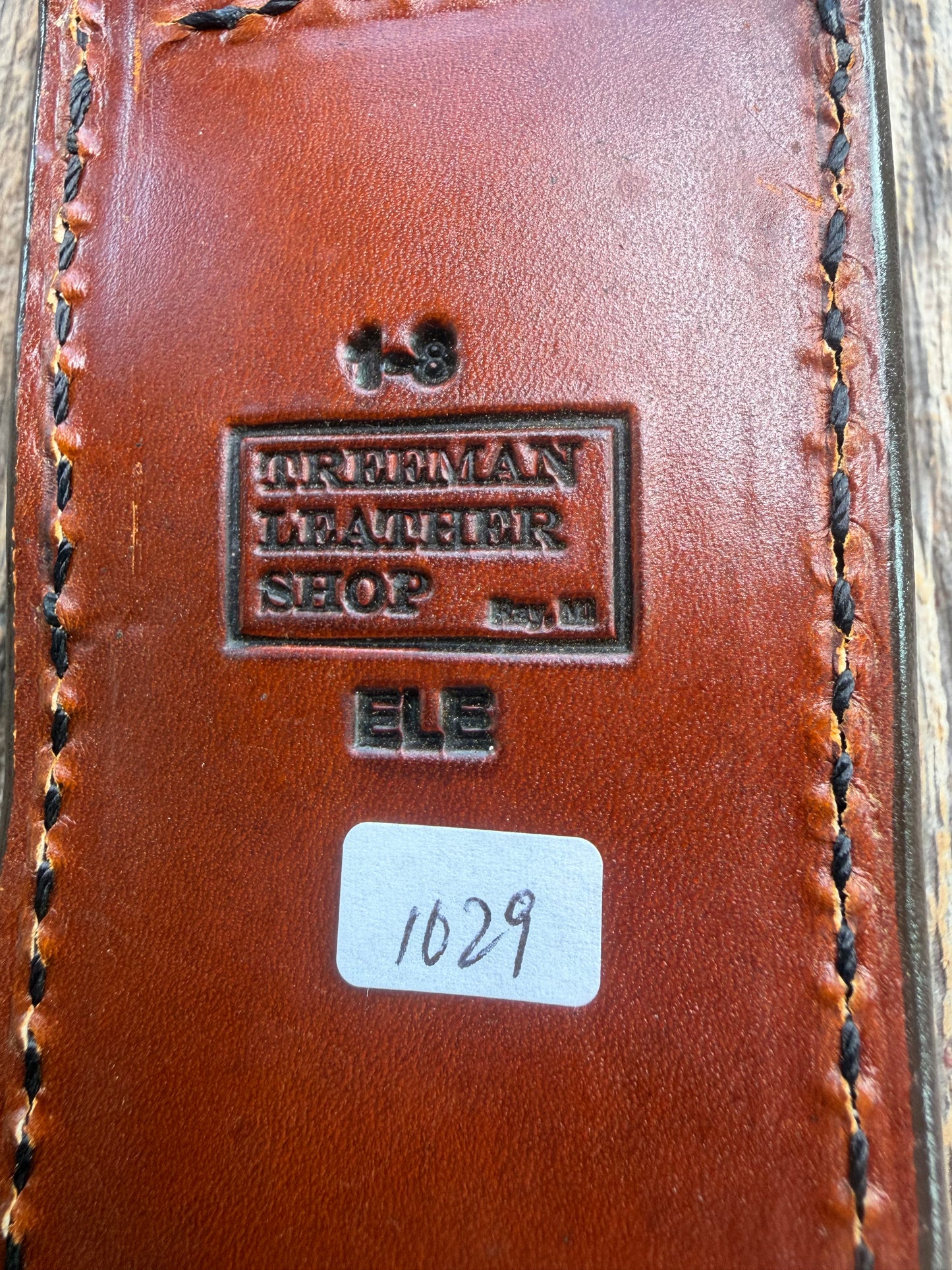 New Randall Model 1-8 Sheath in Exotic thick and textured Rust colored Elephant hide on brown leather from Treeman with a black Canteen snap. Hand tooled belt loop. Killer sheath.