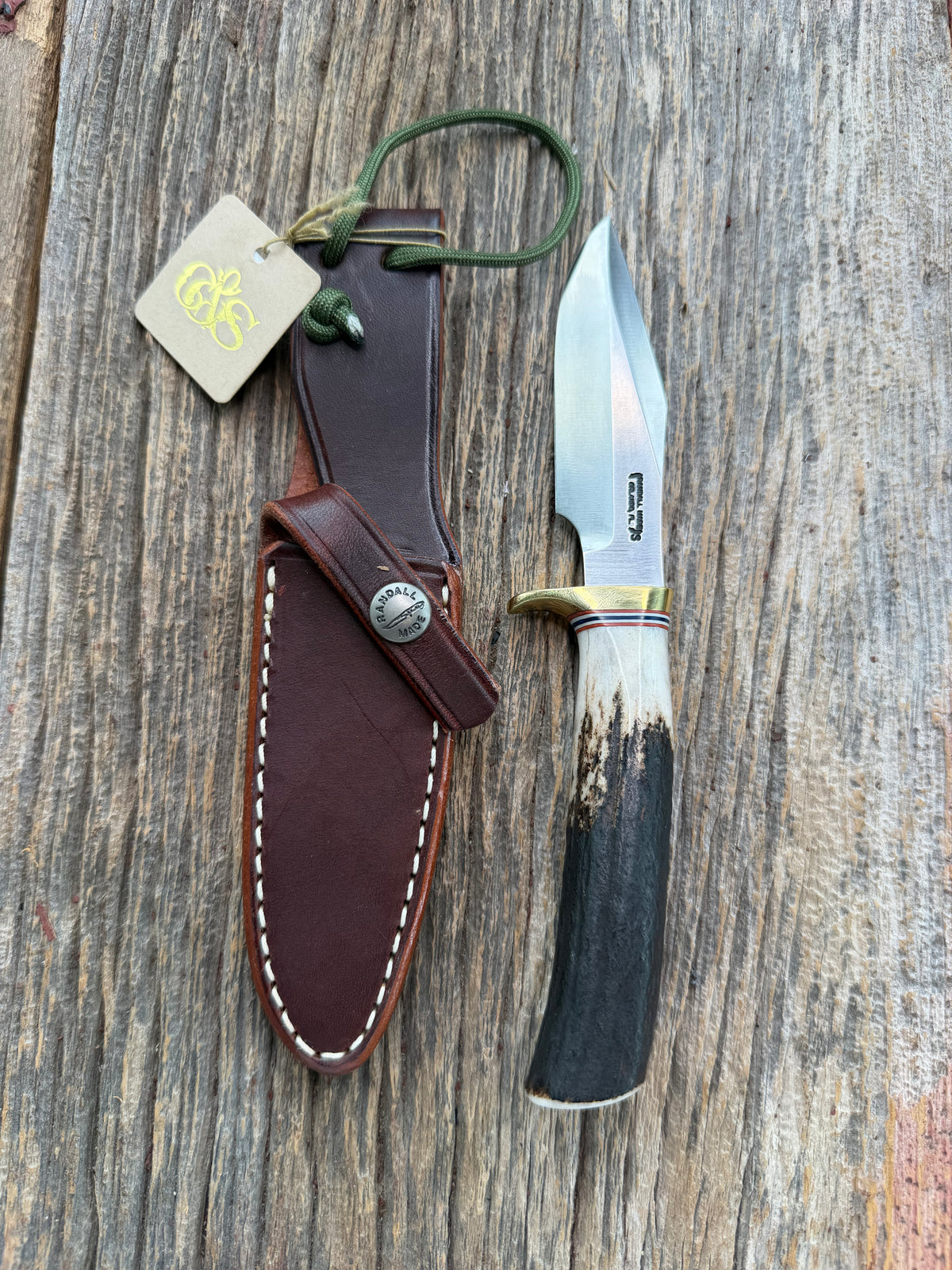 New Randall Model 8-4 with a Stag handle. Stainless steel blade, brass single hilt and natural butt. Red white and Blue spacers.