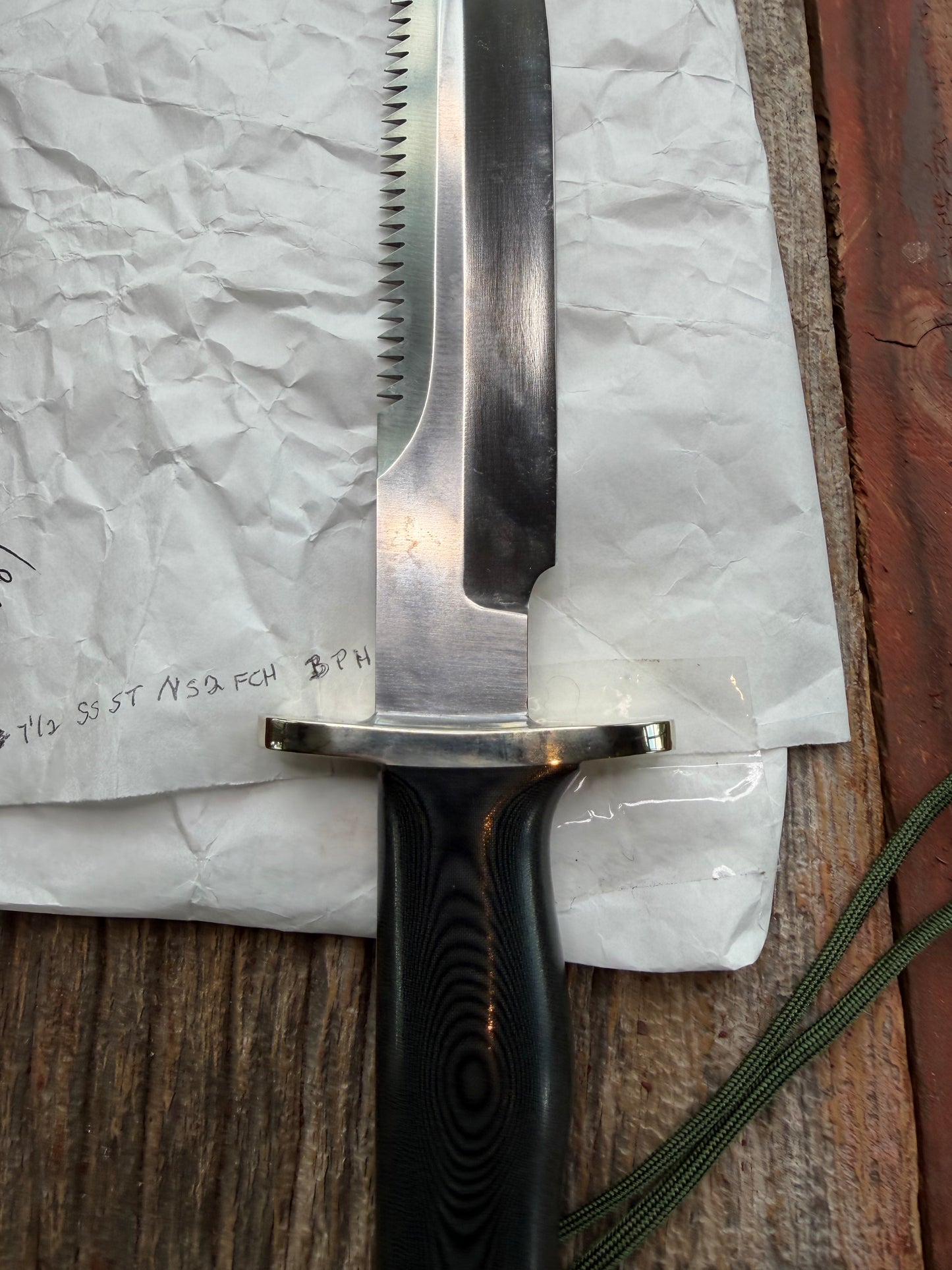 New in Paper Randall Model 14-7.5 in Black Micarta handle, Nickel Silver Hilt, Stainless steel, Sawteeth and Lanyard.