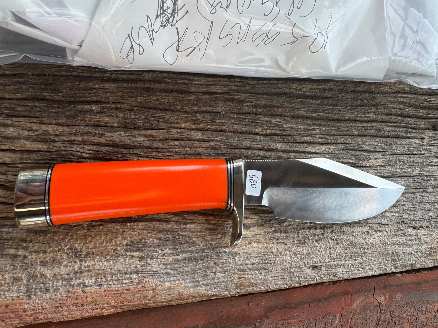 New in paper Randall Model 19-5 with a nice piece of customer supplied Orange G10. Stainless Steel, Nickel Silver Hilt and Butt cap.