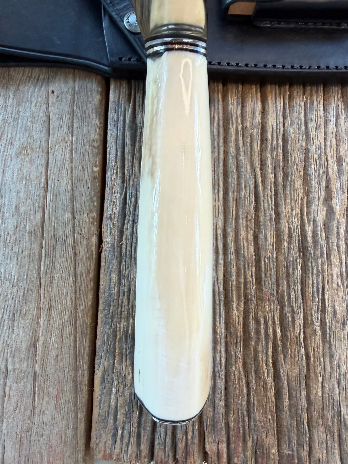 New in Paper Randall Model 12-11 Dealer Special Large Sasquatch Huge piece of Pearly White Fossil walrus Ivory, Finger Groves , # 1134 Nickel Silver Hilt and butt cap.
