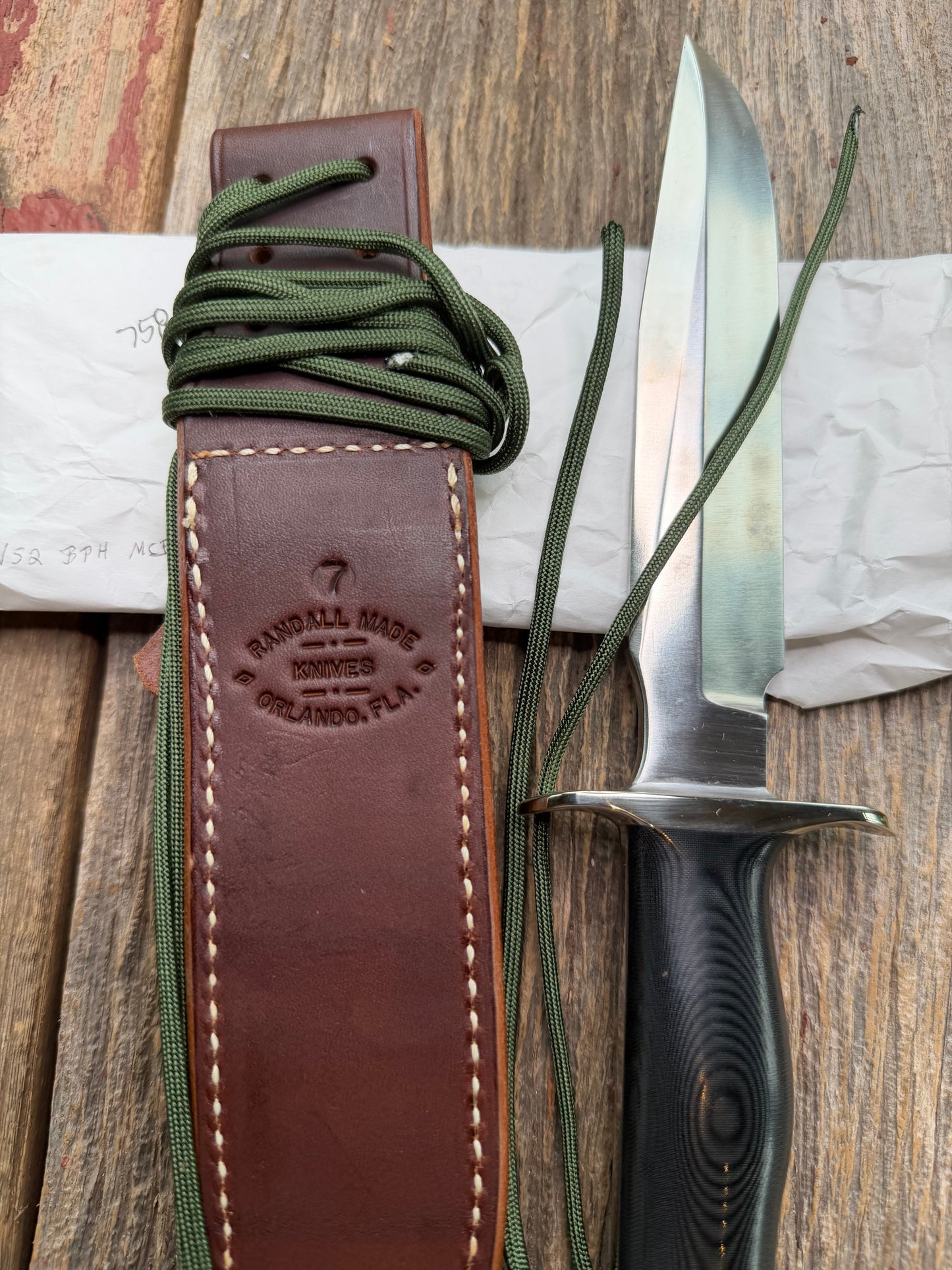 New in Paper Randall Model 16 SP#1 Special fighter with a Black Micarta handle. SS blade, Nickel silver hilt. Lanyard. Brown leather sheath.