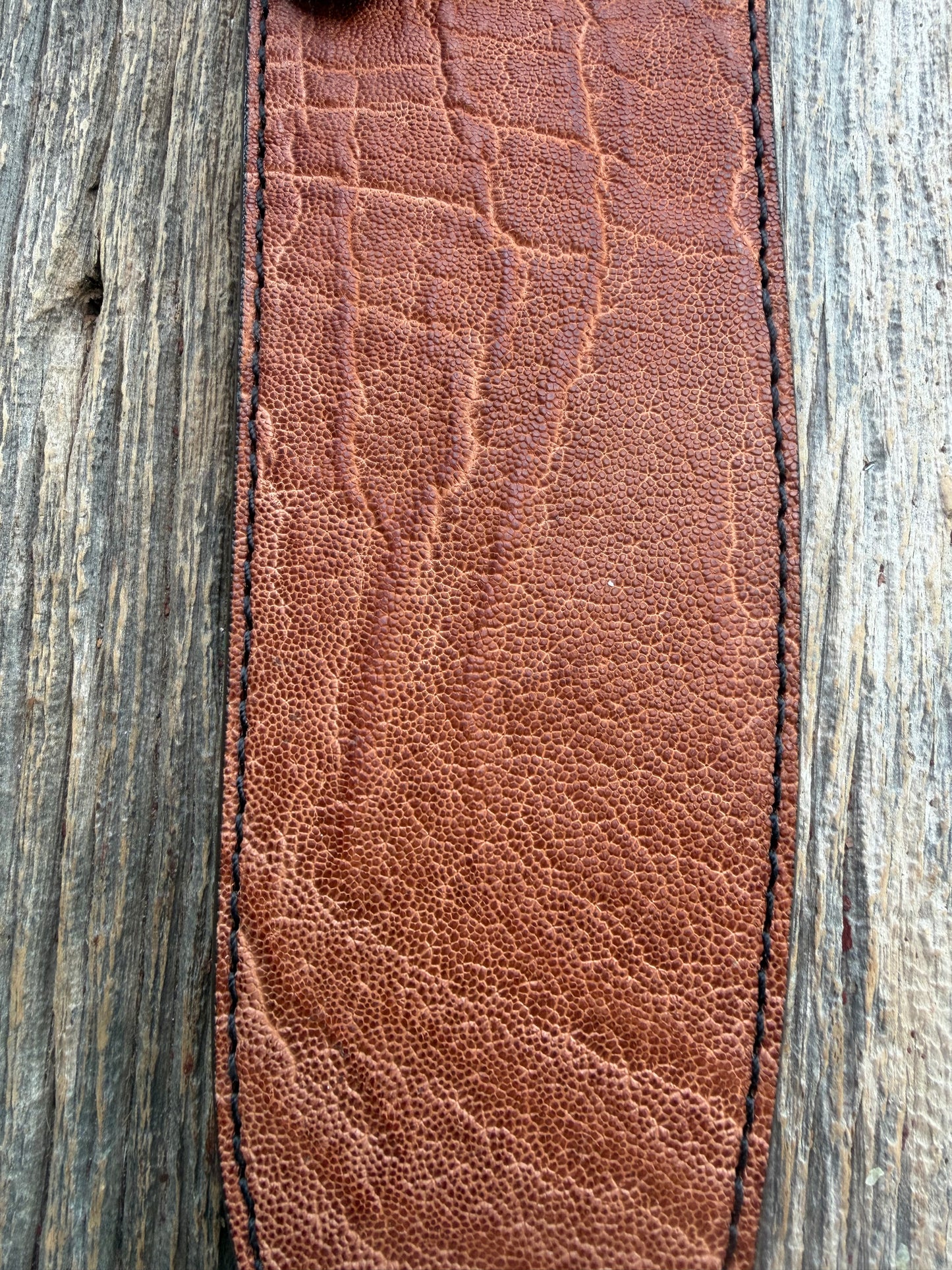 New Randall Model 12-11 Large Sasquatch Sheath in Exotic thick and textured Rust colored Elephant hide on brown leather from Treeman with a black Canteen snap. Hand tooled belt loop. Killer sheath.