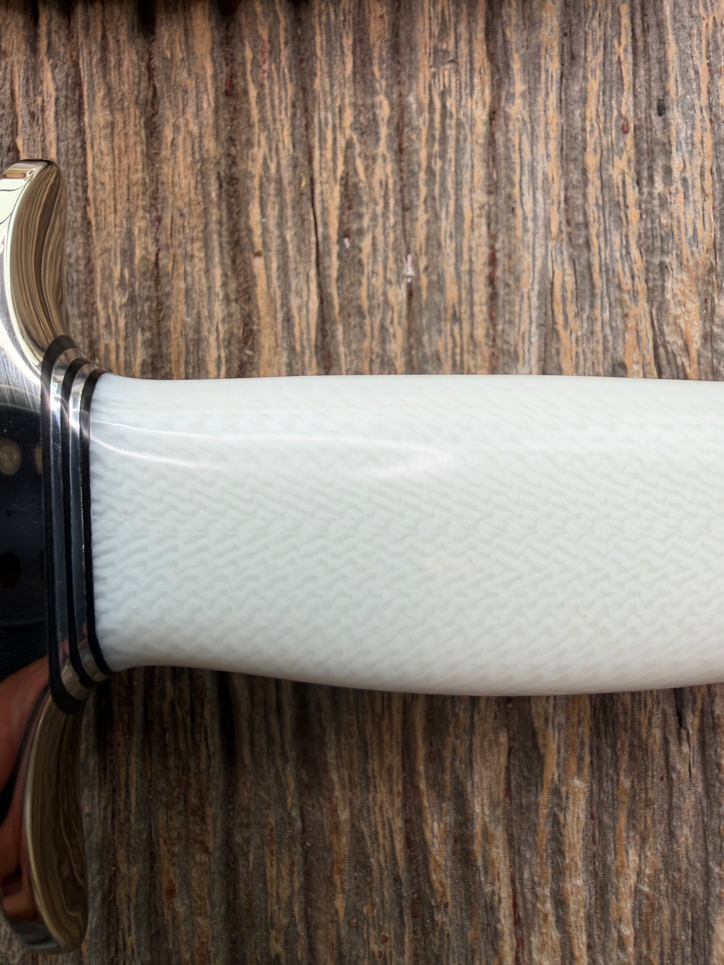New in Paper Randall Model 19-5 Bushmaster with a White Ivorite handle. Stainless steel blade, Nickel silver hilt. Upgraded Black leather sheath. Crows Beak Aluminum handle.