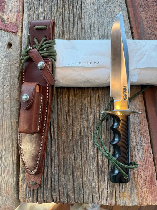 New in Paper Randall Model 16 SP#1 Special fighter with a Black Micarta handle. SS blade, Nickel silver hilt. Lanyard. Brown leather sheath.