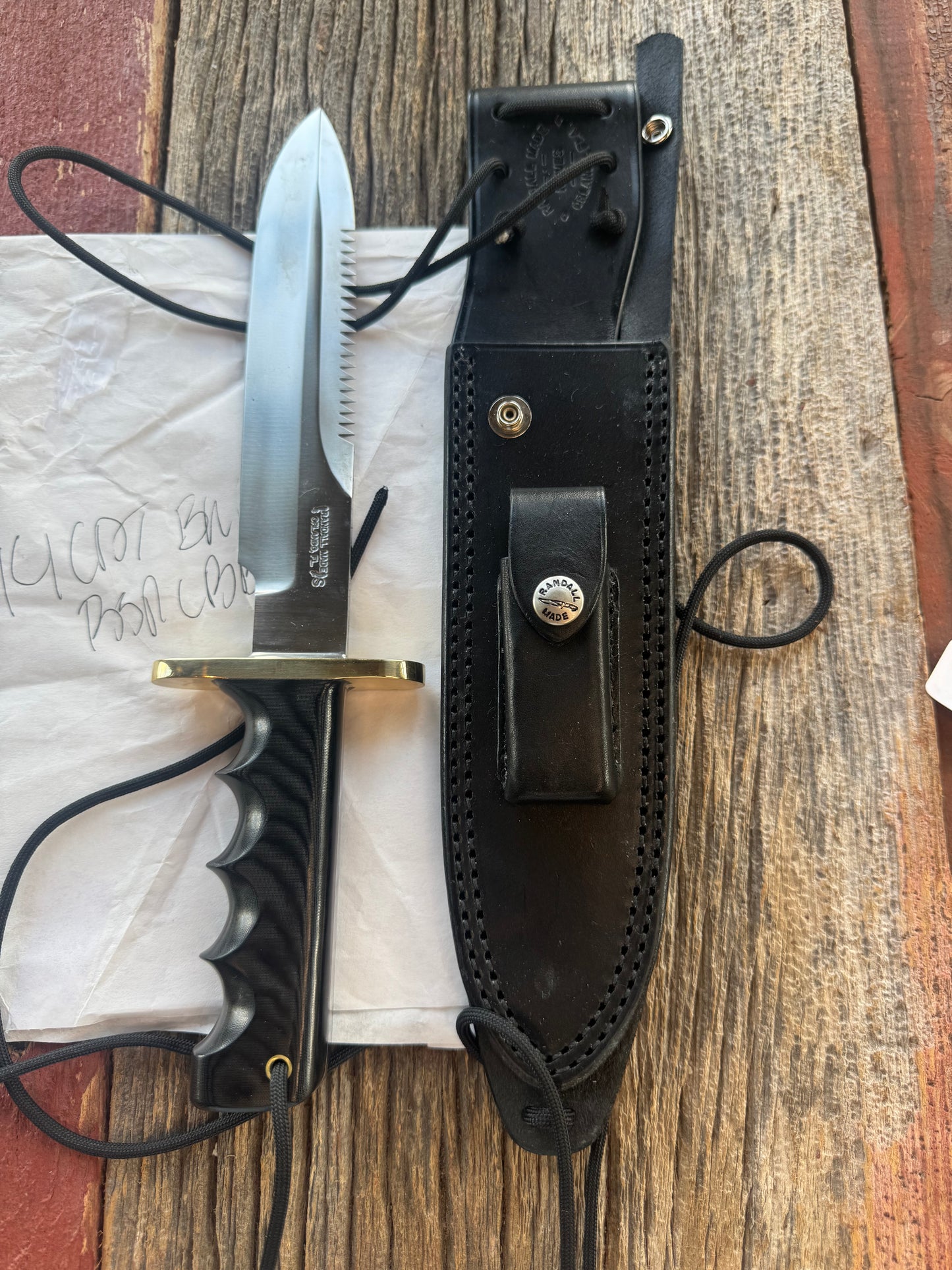 New in Paper Randall Knife Model 14 CDT Black Micarta Brass Hilt Full Tang Stainless, Sawteeth, black sheath.