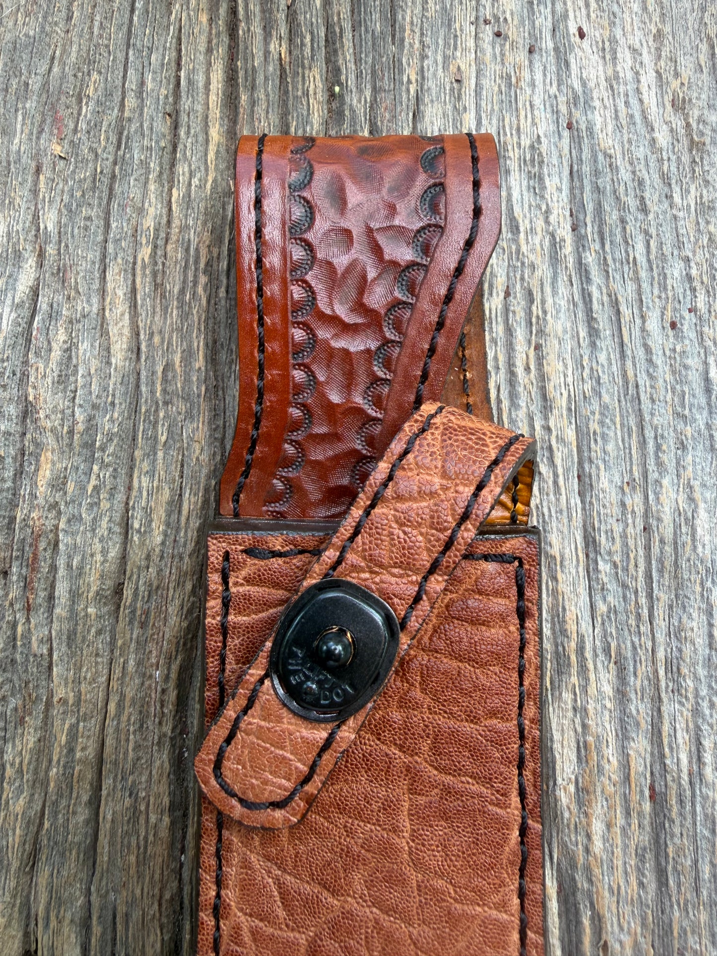 New Randall Model 1-7 Sheath in Exotic thick and textured Rust colored Elephant hide on brown leather from Treeman with a black Canteen snap. Hand tooled belt loop. Killer sheath.