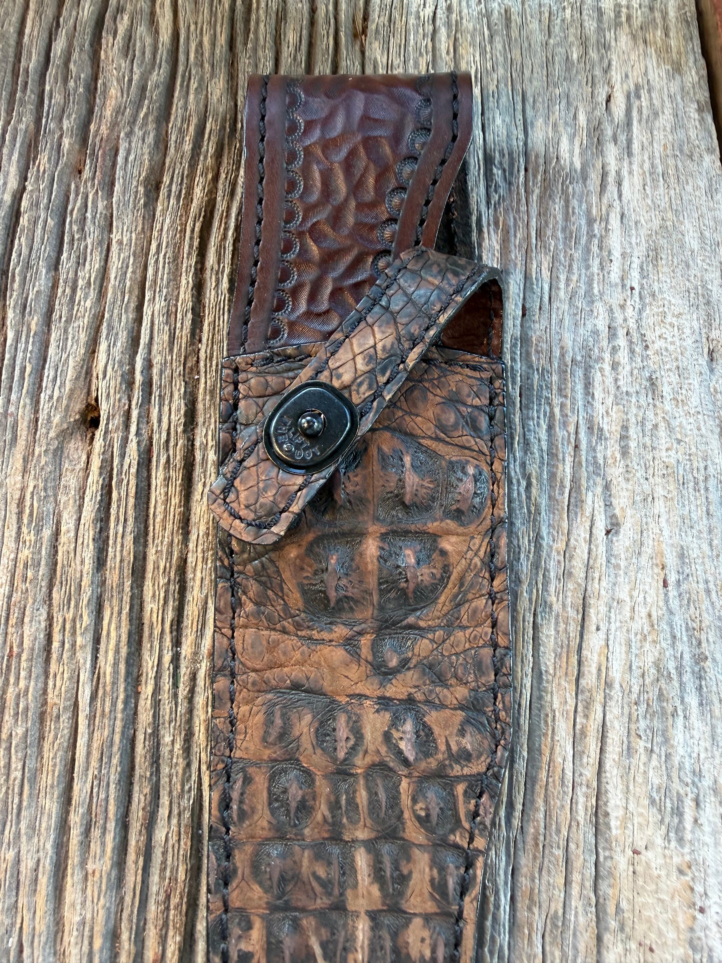New Randall Model 12-8 Big Bear Sheath in Exotic Dark Brown Sueded Crocodile ( Skull and Hornback) from Treeman with the newest Black Canteen snap.