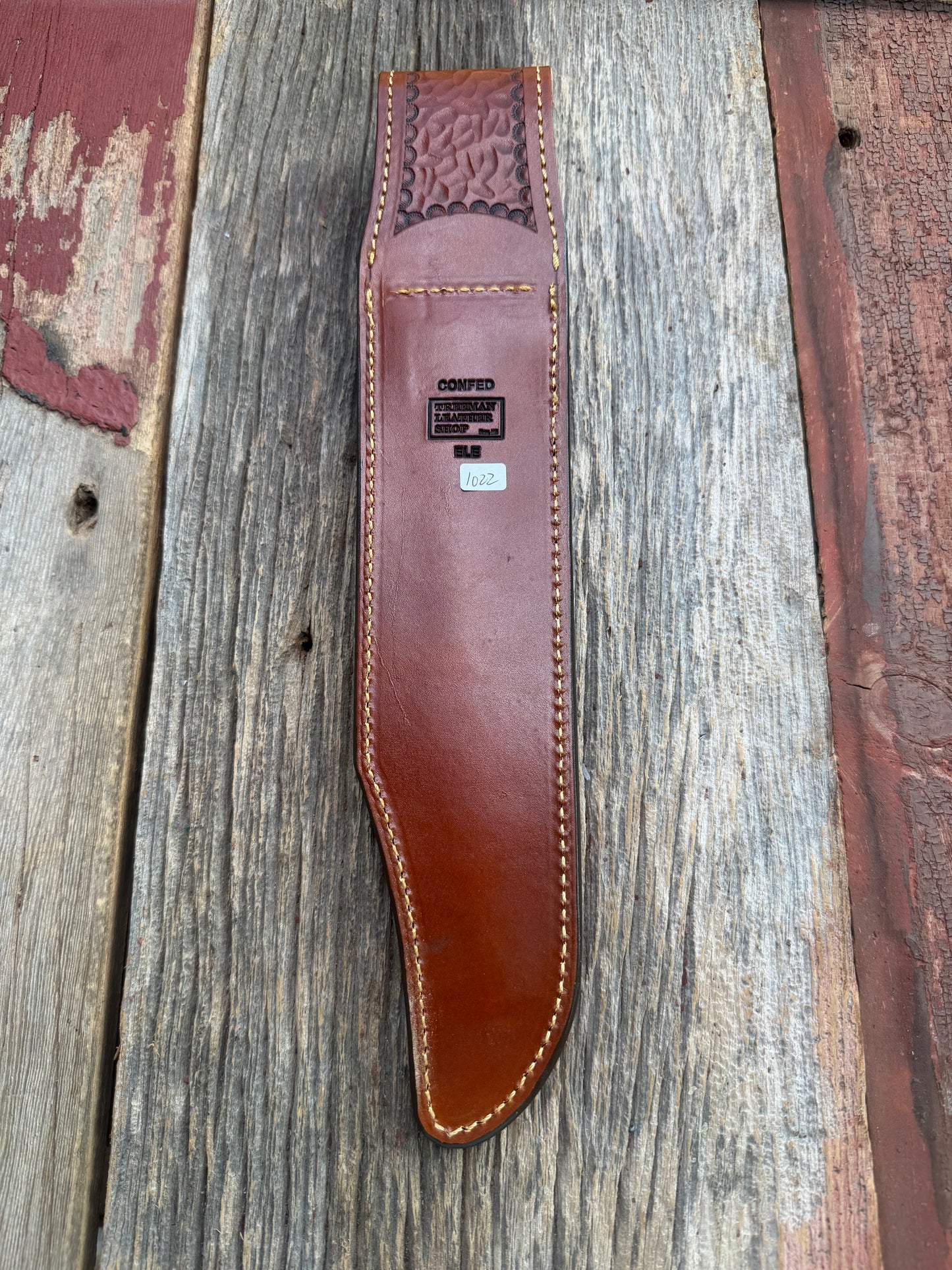 New Randall Model 12-11 Confederate Sheath in Exotic thick and textured Rust colored Elephant hide on brown leather from Treeman with a silver Canteen snap. Hand tooled belt loop. Killer sheath.