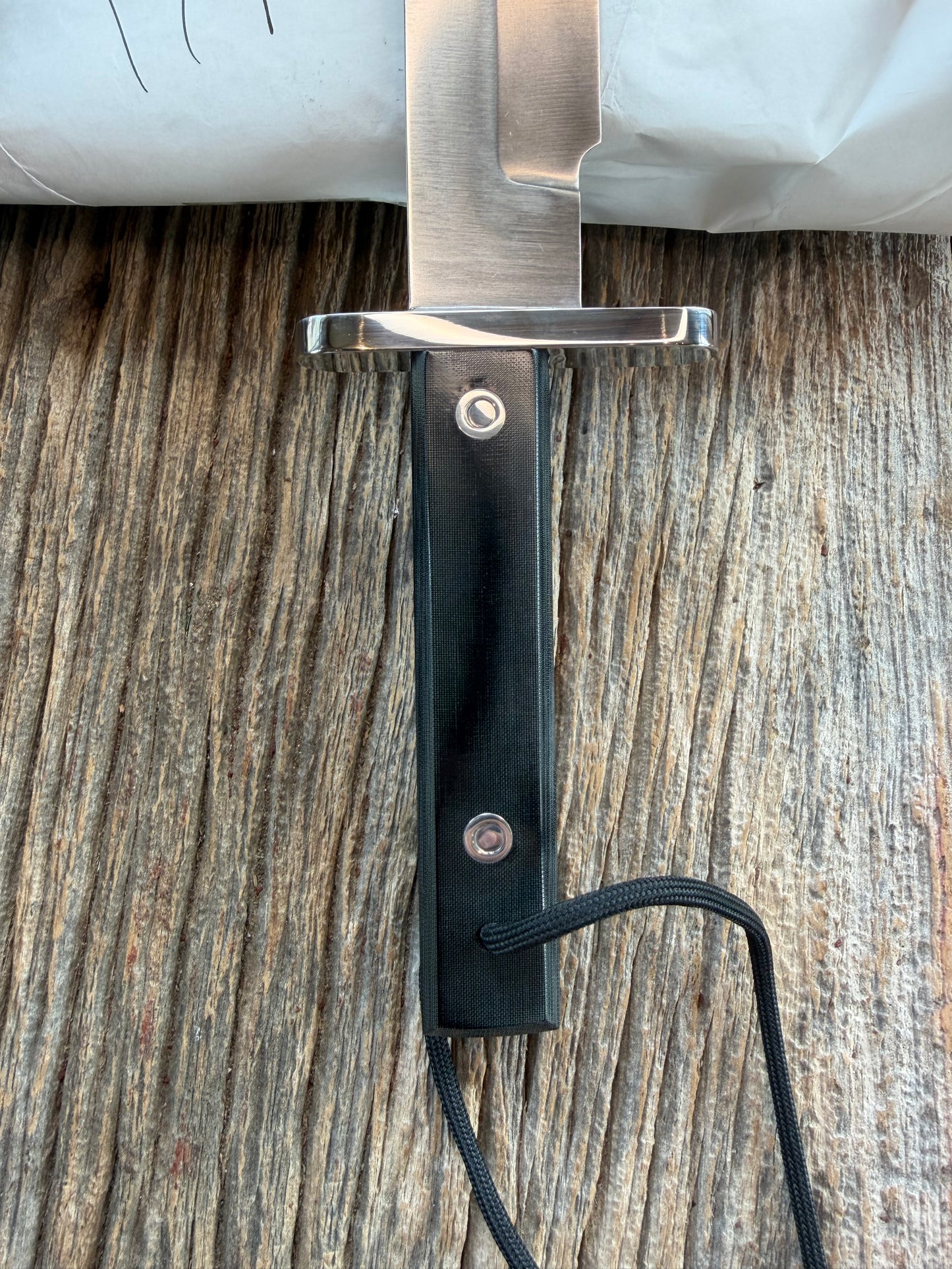 New in Paper Randall Model 17-5.5 Astro knife is a custom, handmade combat knife with a 5.5" stainless steel clip point blade and a brown leather sheath. Full tang design, black handle.