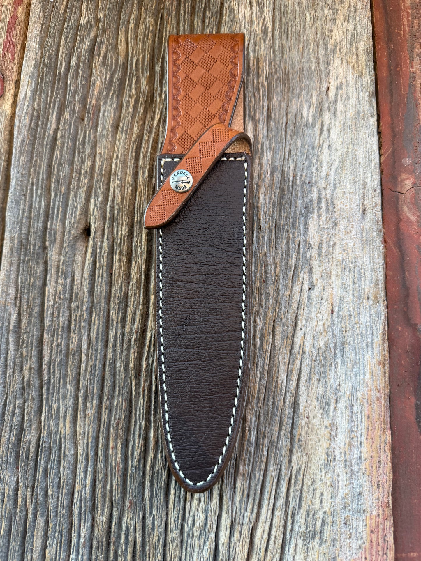 New Randall Model 2-7 Sheath in Exotic Brown Cape Buffalo with full leather hand tooled belt loop. Randall snap and stamp on the back. Custom Made at Sullivan’s by Gutcher