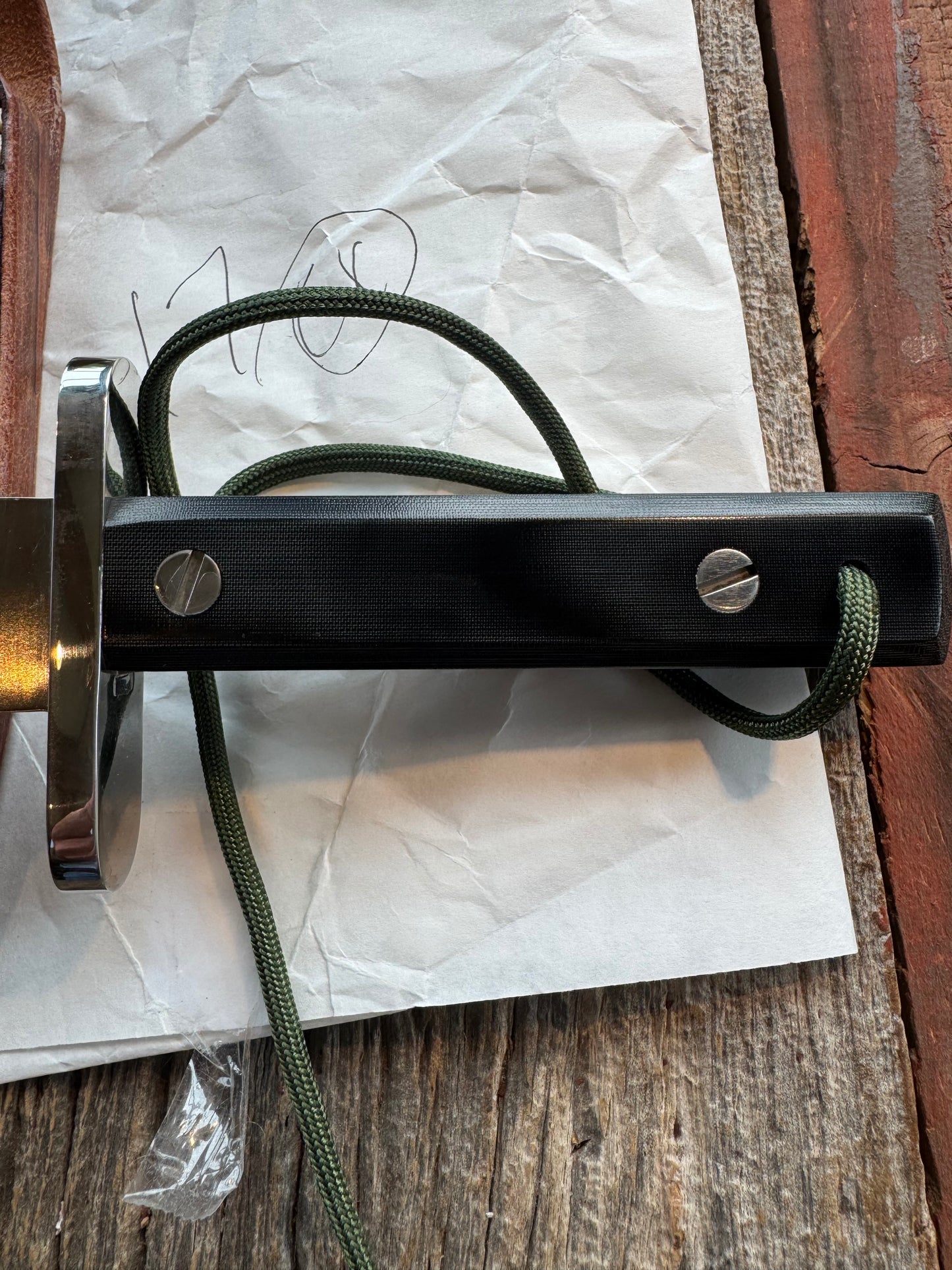 New in Paper Randall Model 17-5.5 Astro knife is a custom, handmade combat knife with a 5.5" stainless steel clip point blade and a brown leather sheath. Full tang design, black handle.