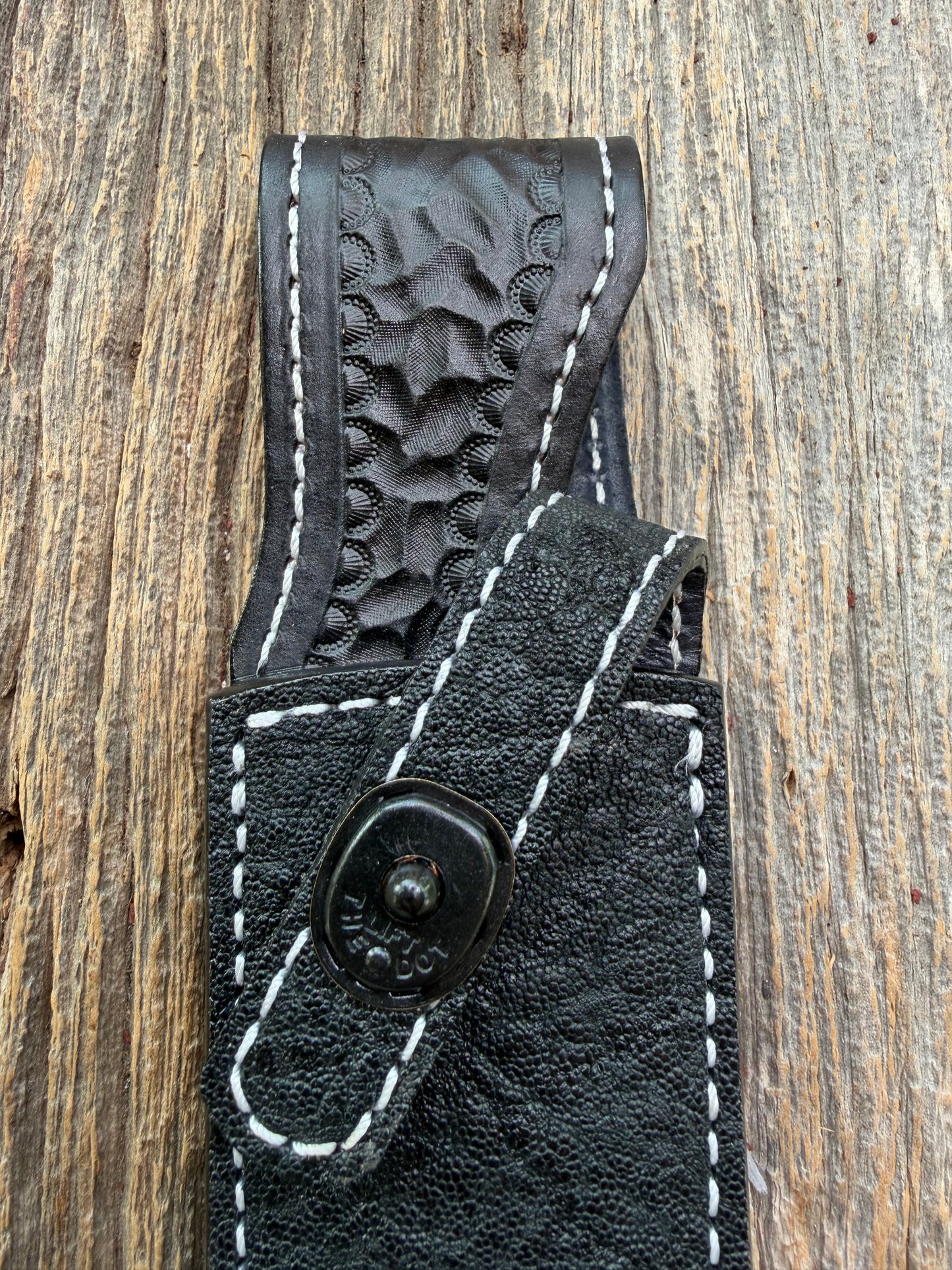 New Randall Model 1-7 Sheath in Exotic thick and textured Black Elephant hide on black leather from Treeman with a black Canteen snap. Hand tooled belt loop. Killer sheath.