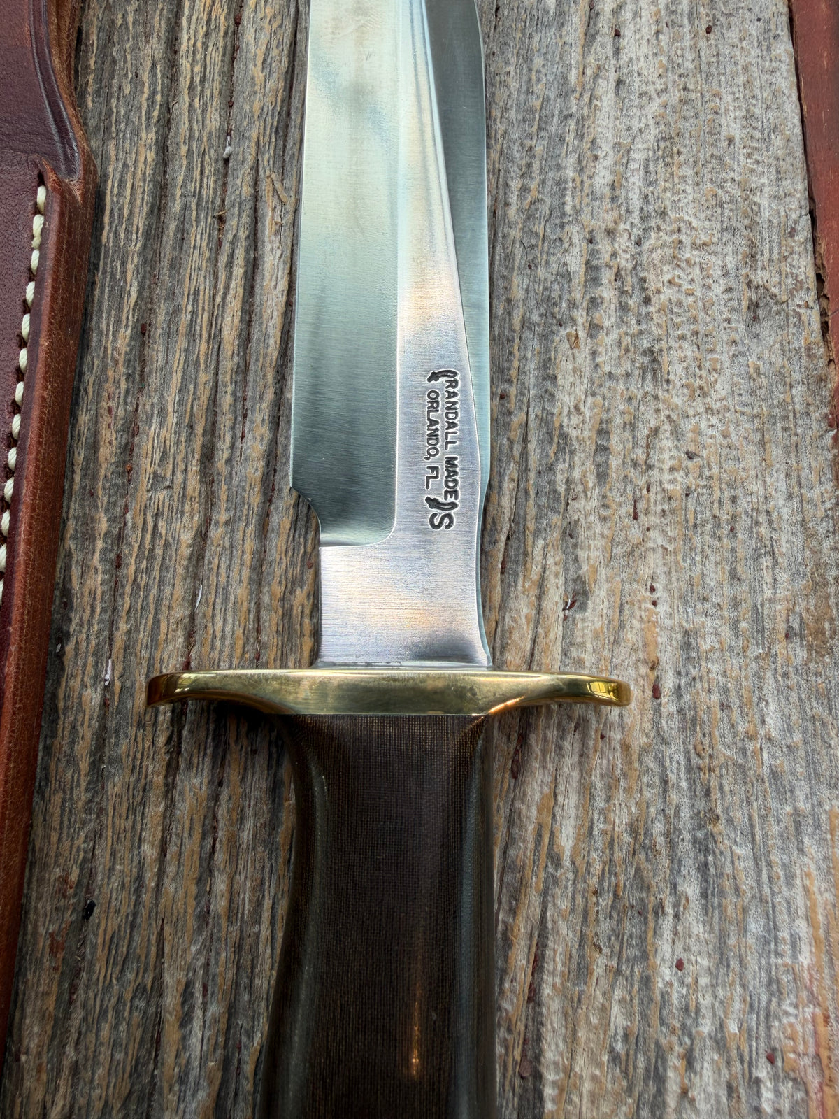 Nice Randall Model 16 SP#1 Special fighter with a Brown Micarta handle. SS blade, brass hilt. Lanyard. Brown leather sheath.
