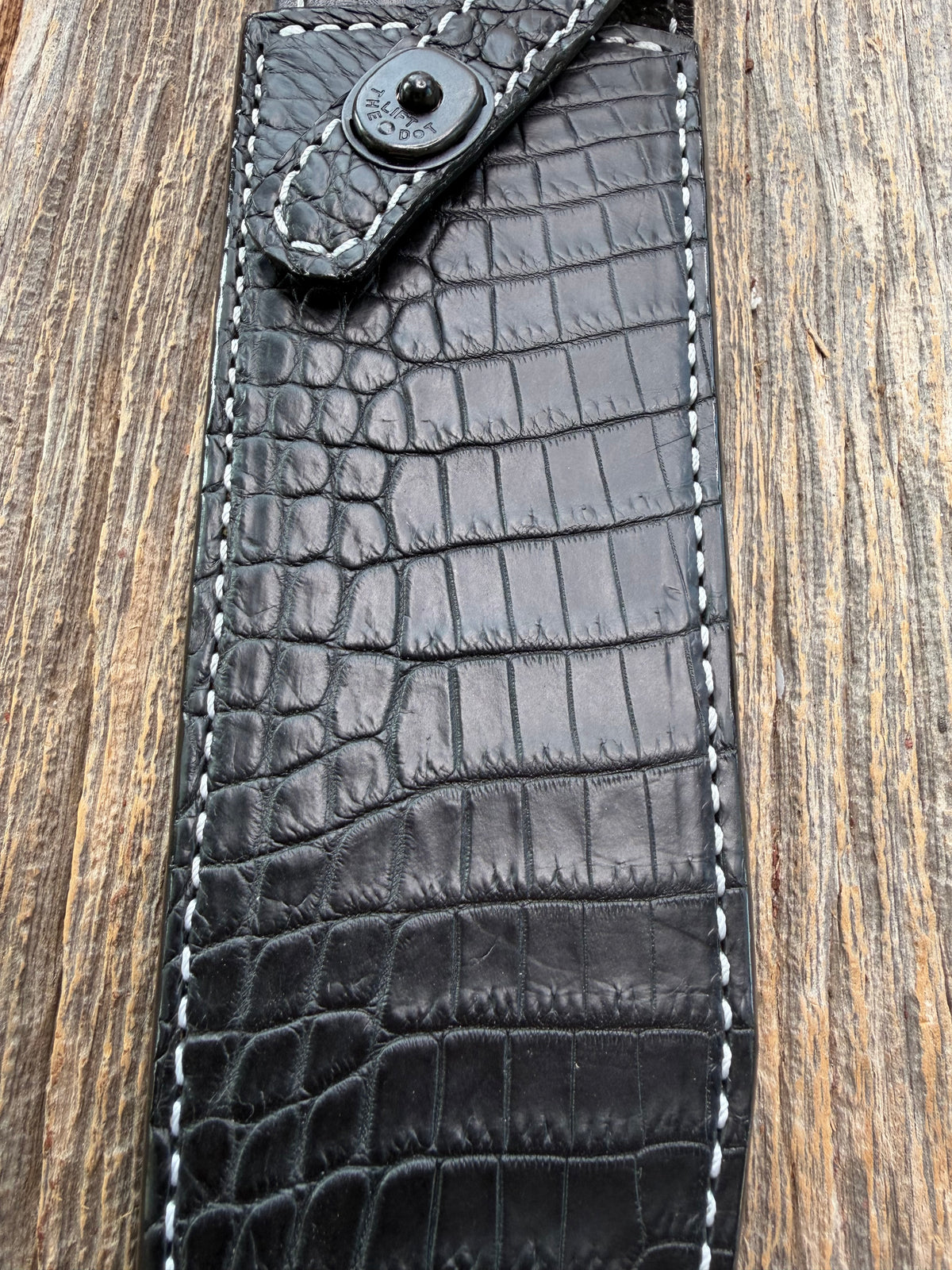 New Randall Model 12-9 Sheath in Exotic Black Matte Crocodile from Treeman with a Black Canteen snap. White thread deviated stitching on black leather..Killer sheath.