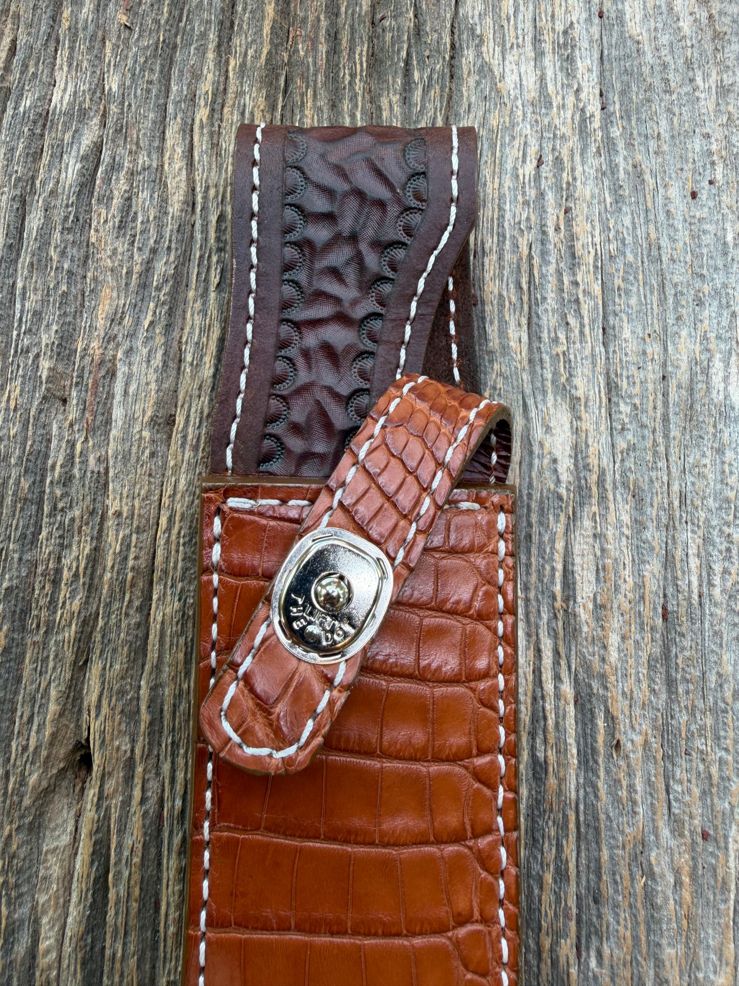 New Randall Model 1-8 Sheath in Exotic thick and textured Honey Crocodile skin on brown leather from Treeman with a silver Canteen snap. Hand tooled belt loop. Killer sheath.